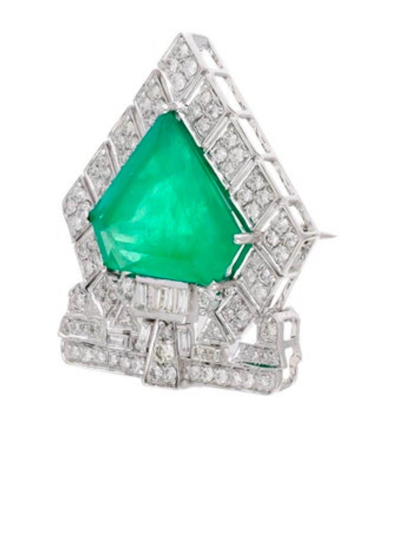 7 Ct Natural Emerald  1 Ct Brilliant cut Diamond Brooch /Pin 18 Kt  White Gold
 The exact weight of the Single emeralds is 7.01 carats. The 18 Karat Gold weight is 7.0 grams, and the emeralds originate from Zambia. This exquisite piece features