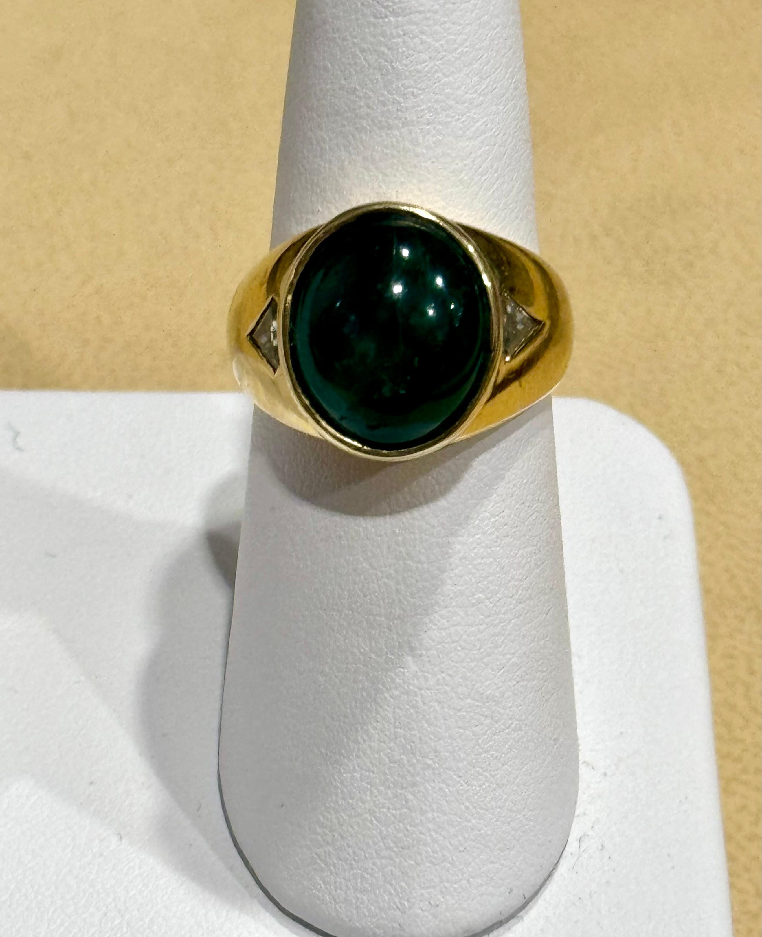 7 Ct Oval Emerald Cabochon 18 Kt Yellow Gold & Diamond Cocktail Ring Vintage Men
This classic cocktail ring is a stunning piece of jewelry that features an approximately 7 carat natural emerald cabochon. The estate piece has not undergone any color