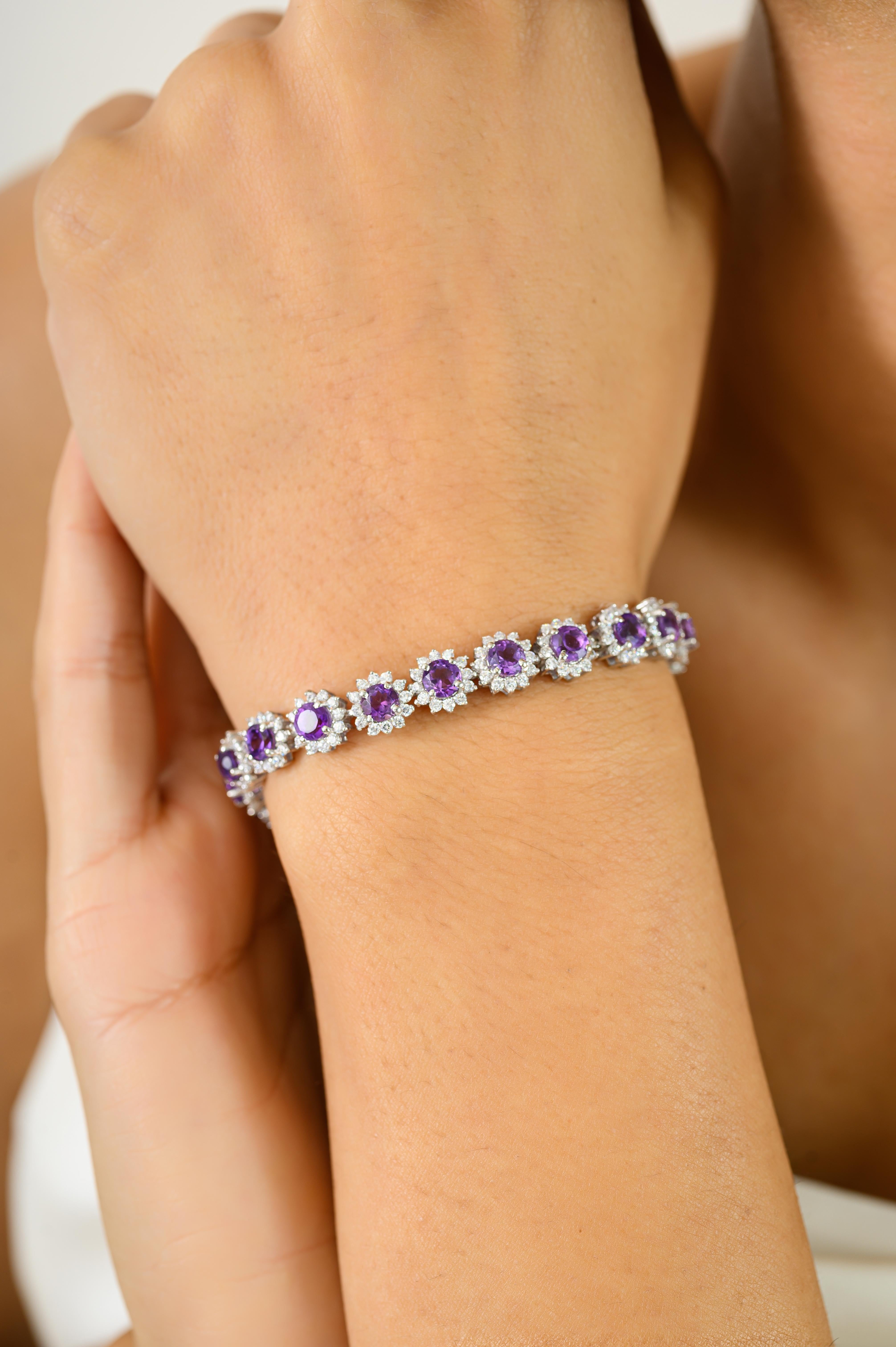 This 7 CTW Purple Amethyst Birthflower Designer Bracelet crafted in 925 sterling silver, this elegant tennis bracelet features radiant round-cut amethysts encircled by shimmering halos of cubic zirconia. The floral-inspired design brings vintage