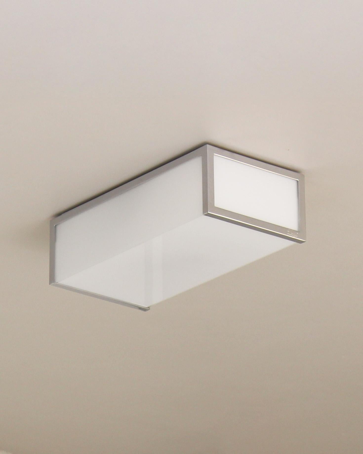 Atelier Jean Perzel - Seven small fine French Art Deco rectangular chrome and white enameled glass ceiling lights. Signed

Price is per fixture.