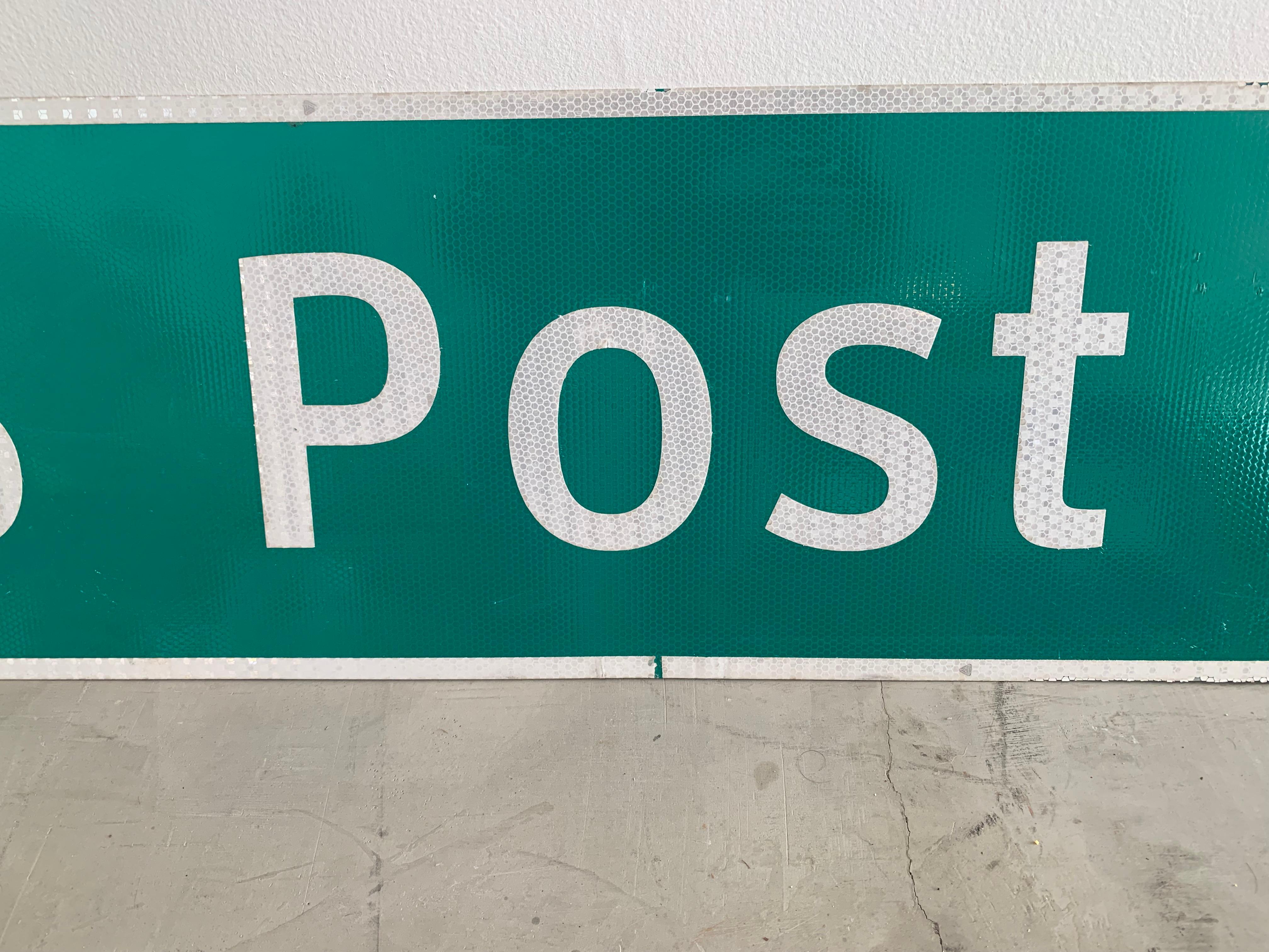 post office road sign