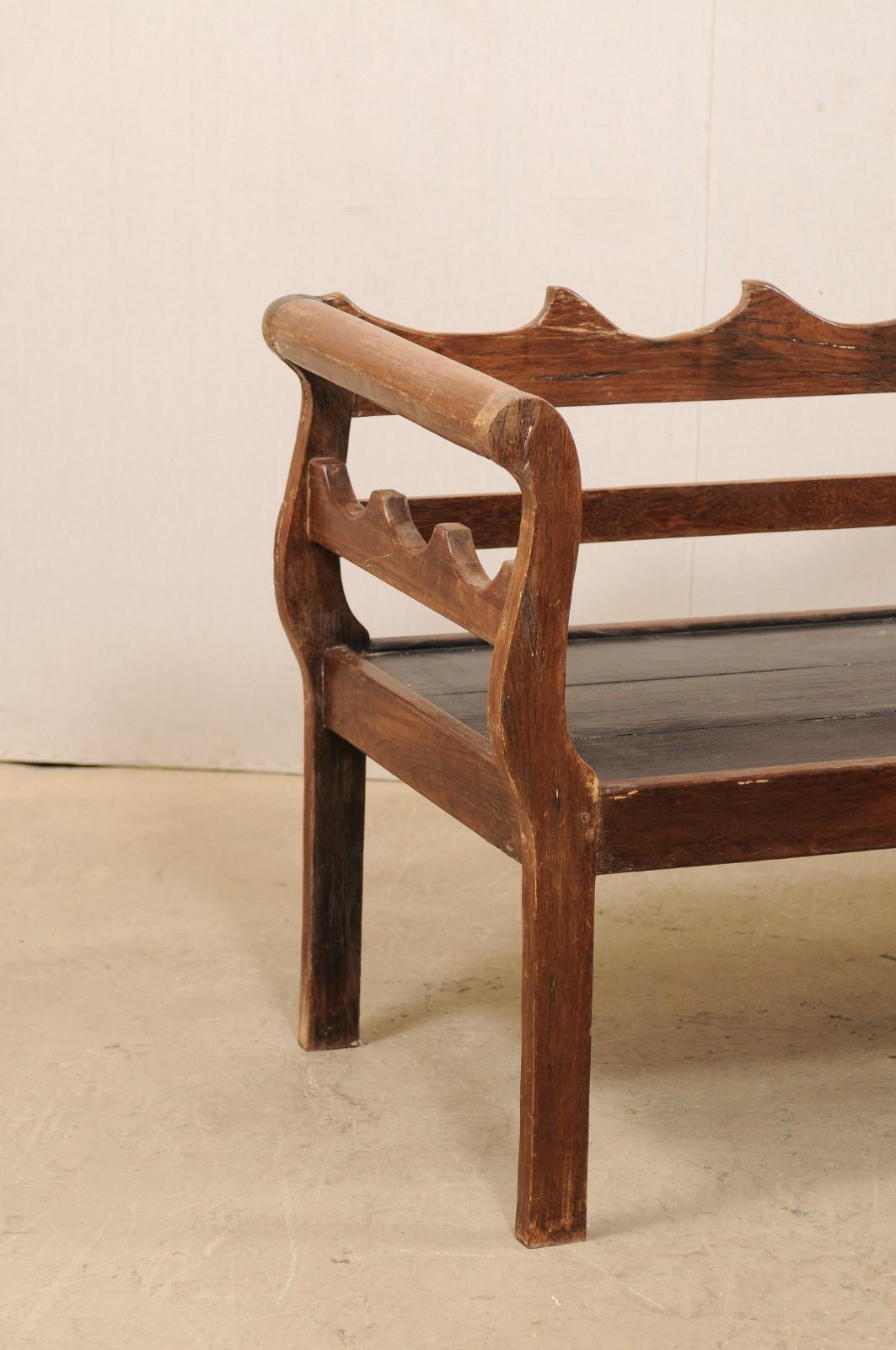carved wood bench with back