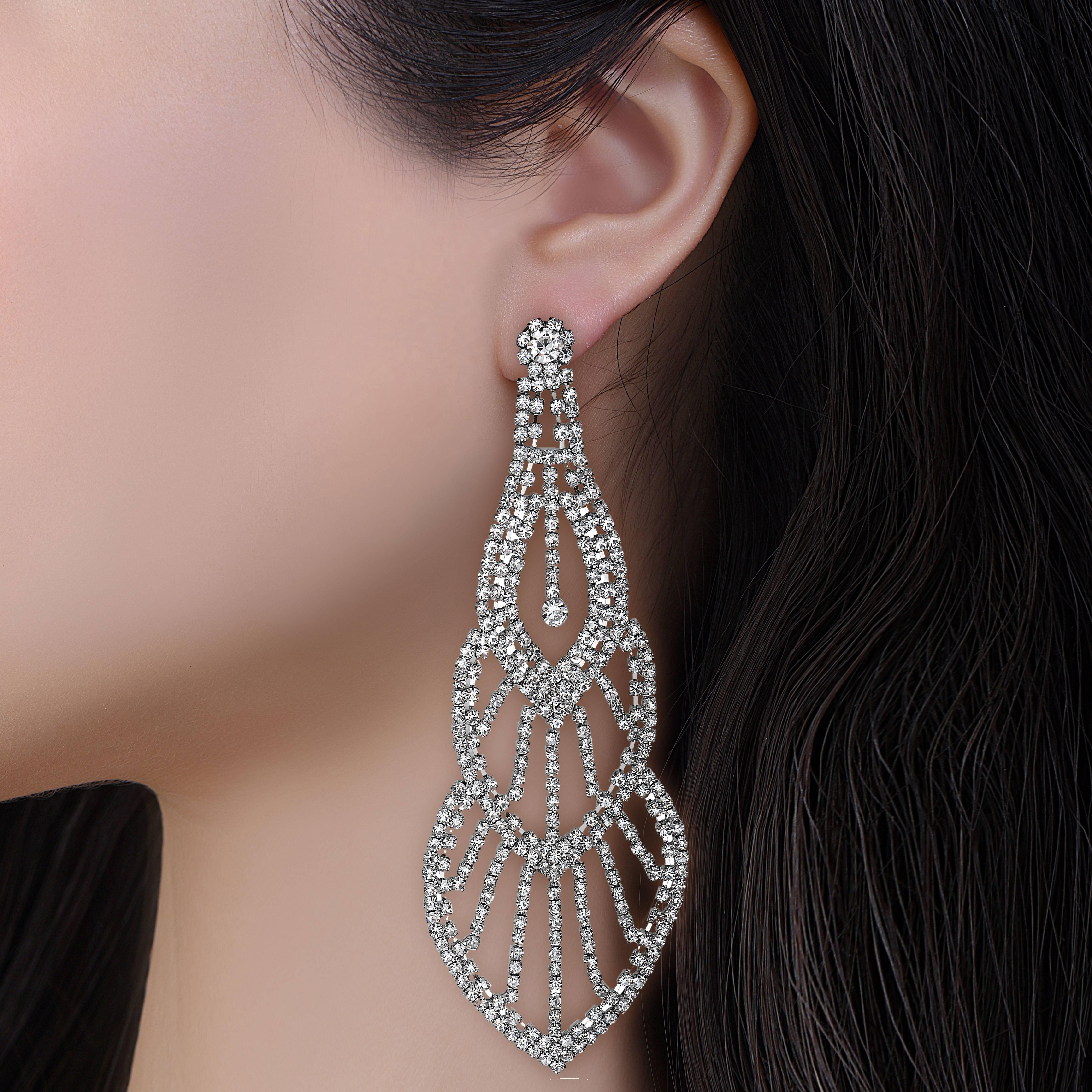 These earrings are very unique and 6.75 Inches long! The diamonds droop all the way down past your shoulder to create a sense of awe. We made the most unique diamond earrings for the woman who wants to be seen on the red carpet with a pair of