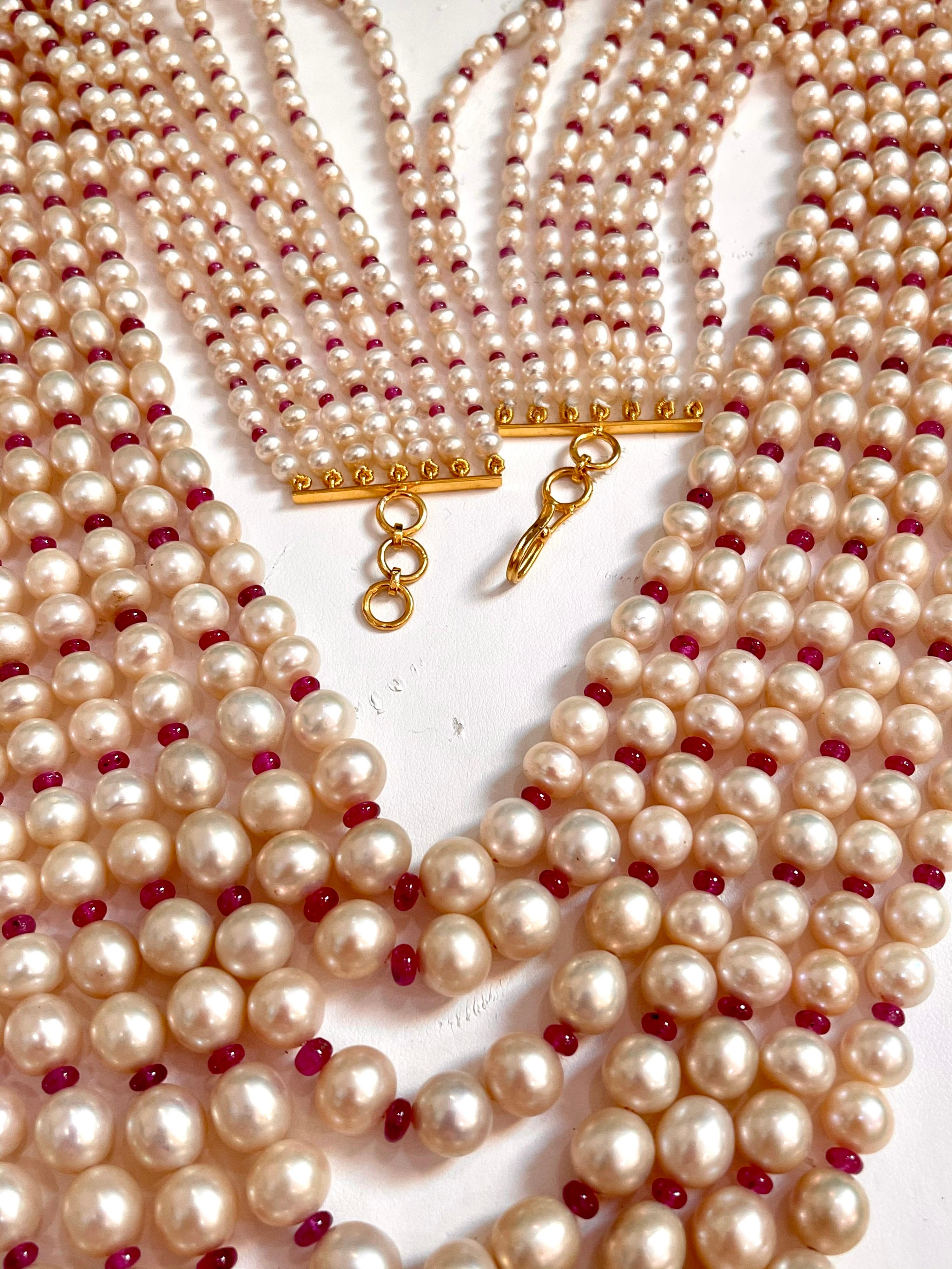  7 Layers of  Fresh water  Pearl with Ruby Beads with  14 Karat yellow gold Spacer clasp Opera Length Necklace
The opera length multi layer pearl necklace set consists of 7  original strands of Natural pearls of lovely nacre, lustre, and