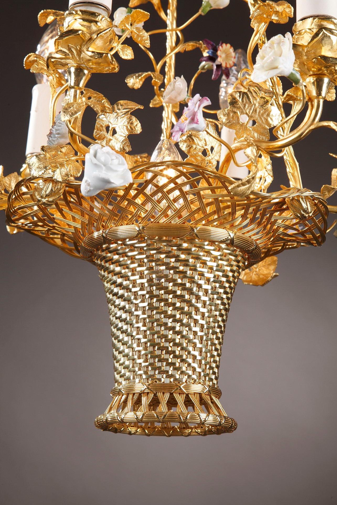 Exquisite 19th century ormolu basket-shaped chandelier with 7-light. The arms of light coil out from an over-flowing basket of flowers, crafted of porcelain in Meissen taste. The stunning symphony of flowers embellish this Rococo-style chandelier.