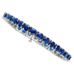 Platinum Tennis Bracelet With 21.50 ct Round Sapphires 7" Long