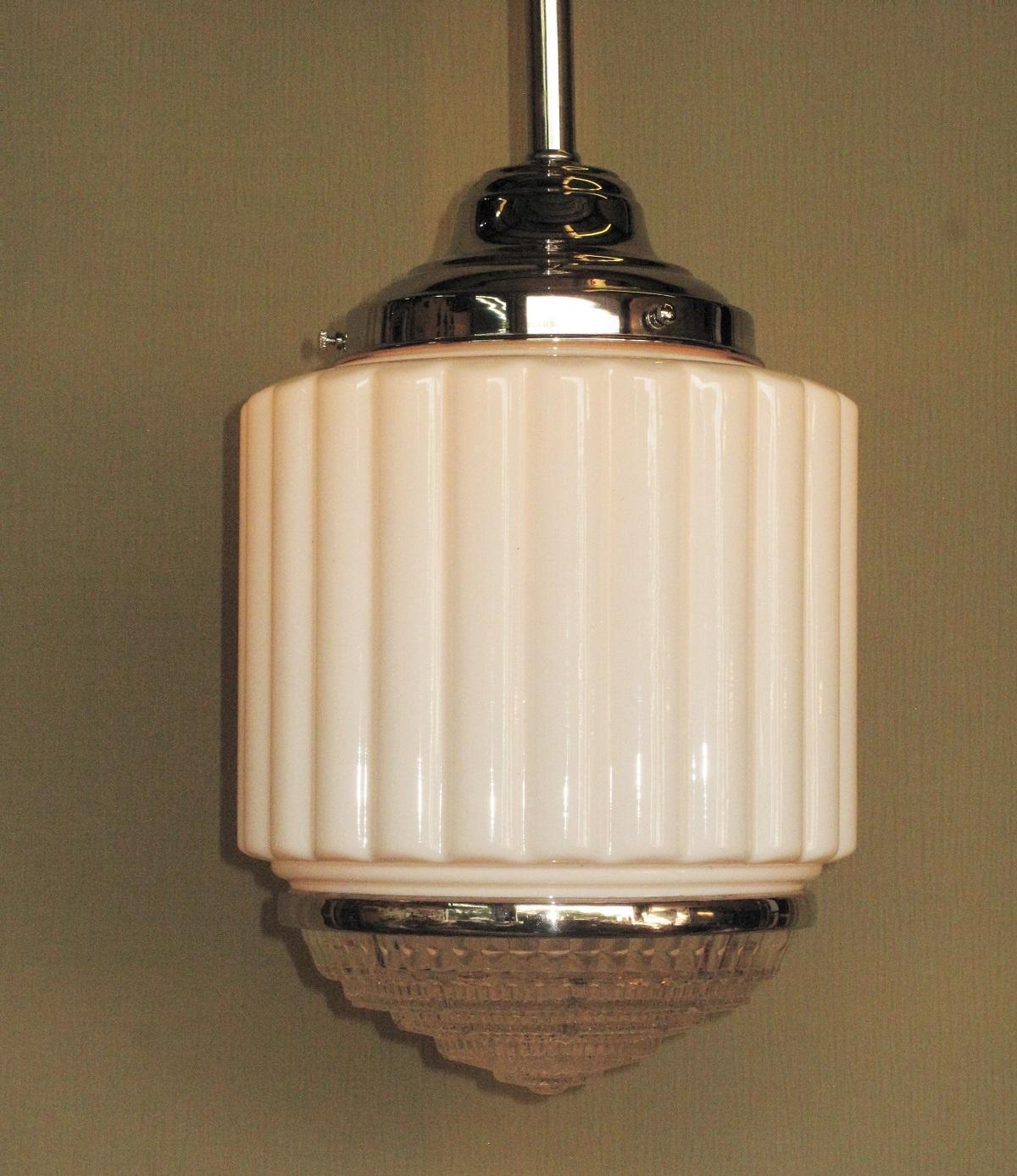 7 matching available, priced each.
Out of a historic property in San Diego's gas lamp district. Classic look with the milk glass portion a series of column ribs, the stepped clear bottom crystal has a series of ribs to help disperse the light.