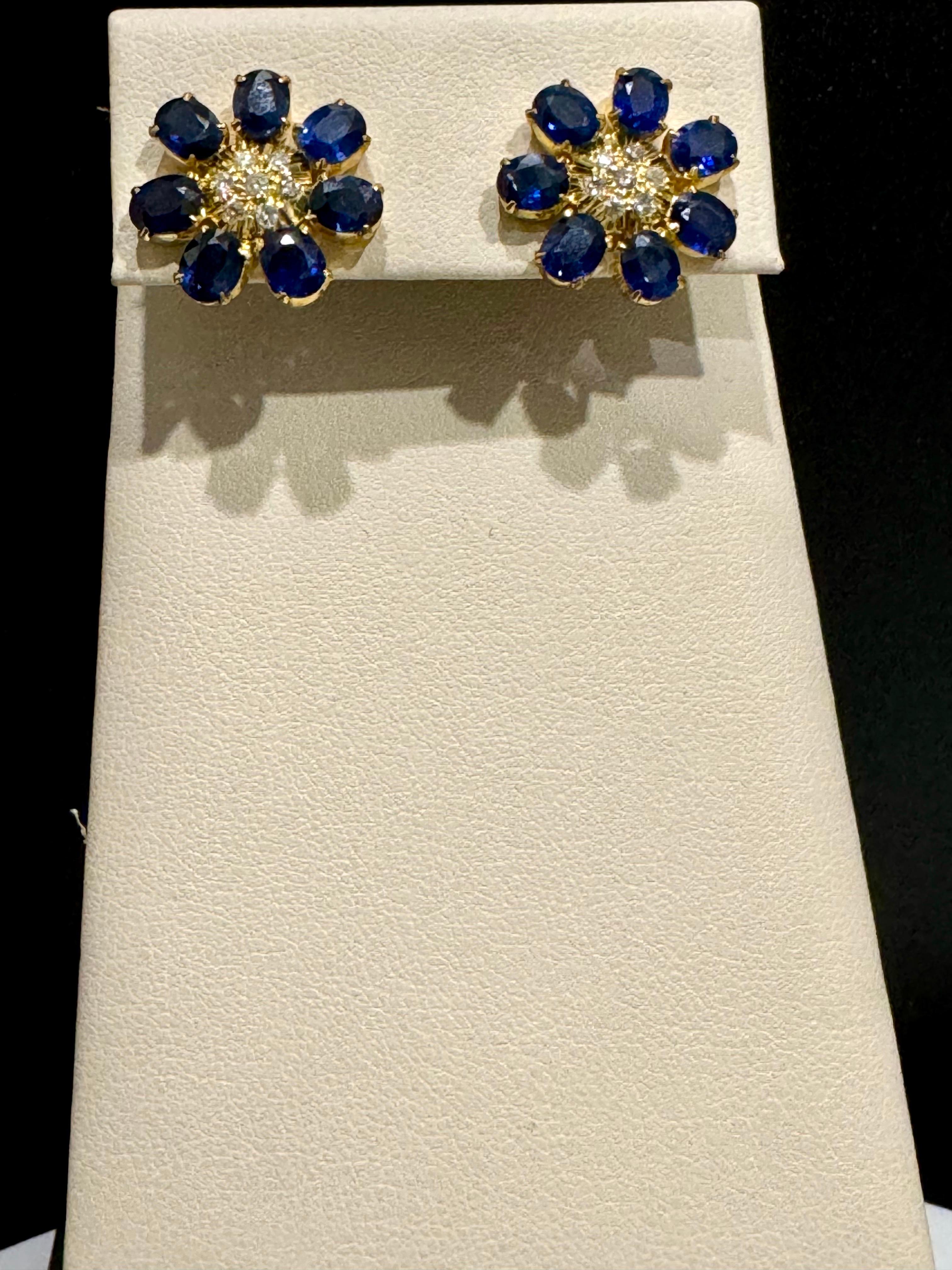 7 Petals Natural Sapphire and Diamonds Flower Post Earrings 18 Karat Yellow Gold
Approximately 4 Carat  Oval Cut Sapphire  and 0.30 ct  diamond flower earrings
 perfect pair  Post  back  Earrings  18 Karat Yellow Gold 
This exquisite pair of