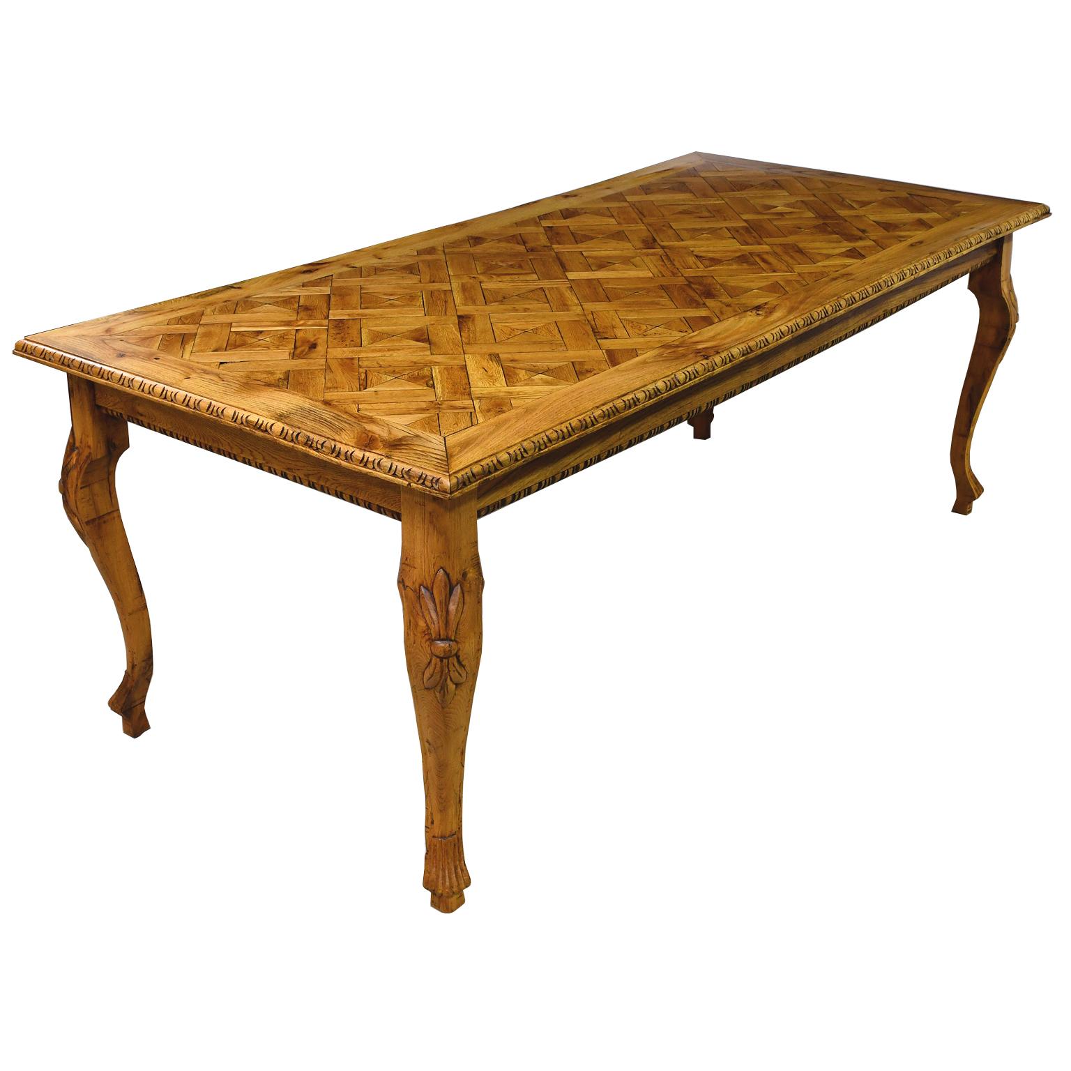 A beautiful custom-made European oak dining table with cabriole legs, carved knee and hand fitted parquetry top. Made entirely from repurposed solid antique oak that is over 200 years old and imported in the late 1990's.
Note: You should always