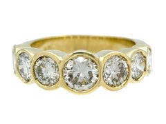 7 Stone Bezel Set Round Cut Diamond Band Ring in Polished 14 Karat Yellow Gold