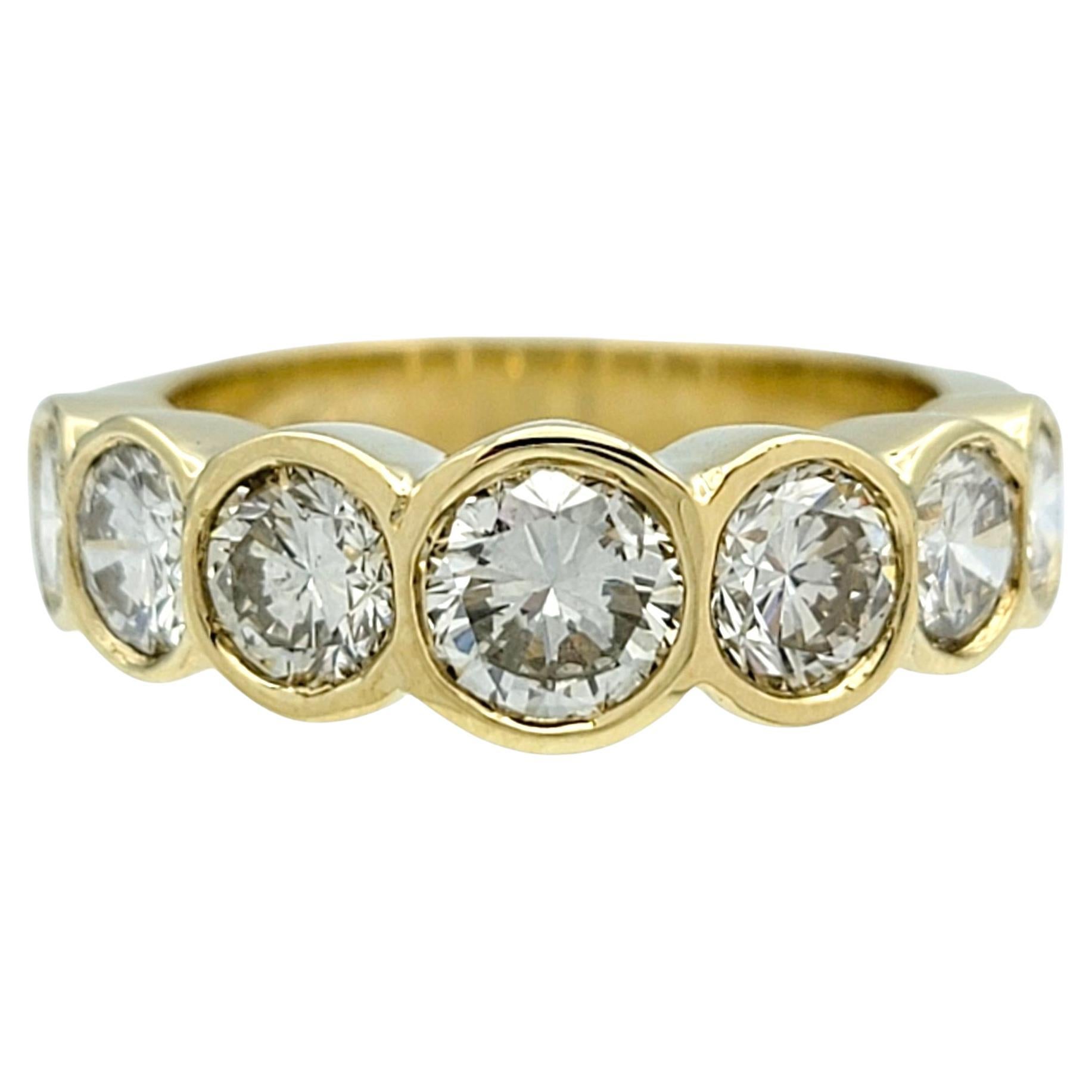 7 Stone Round Cut Bezel Set Diamond Band Ring in Polished 14 Karat Yellow Gold For Sale