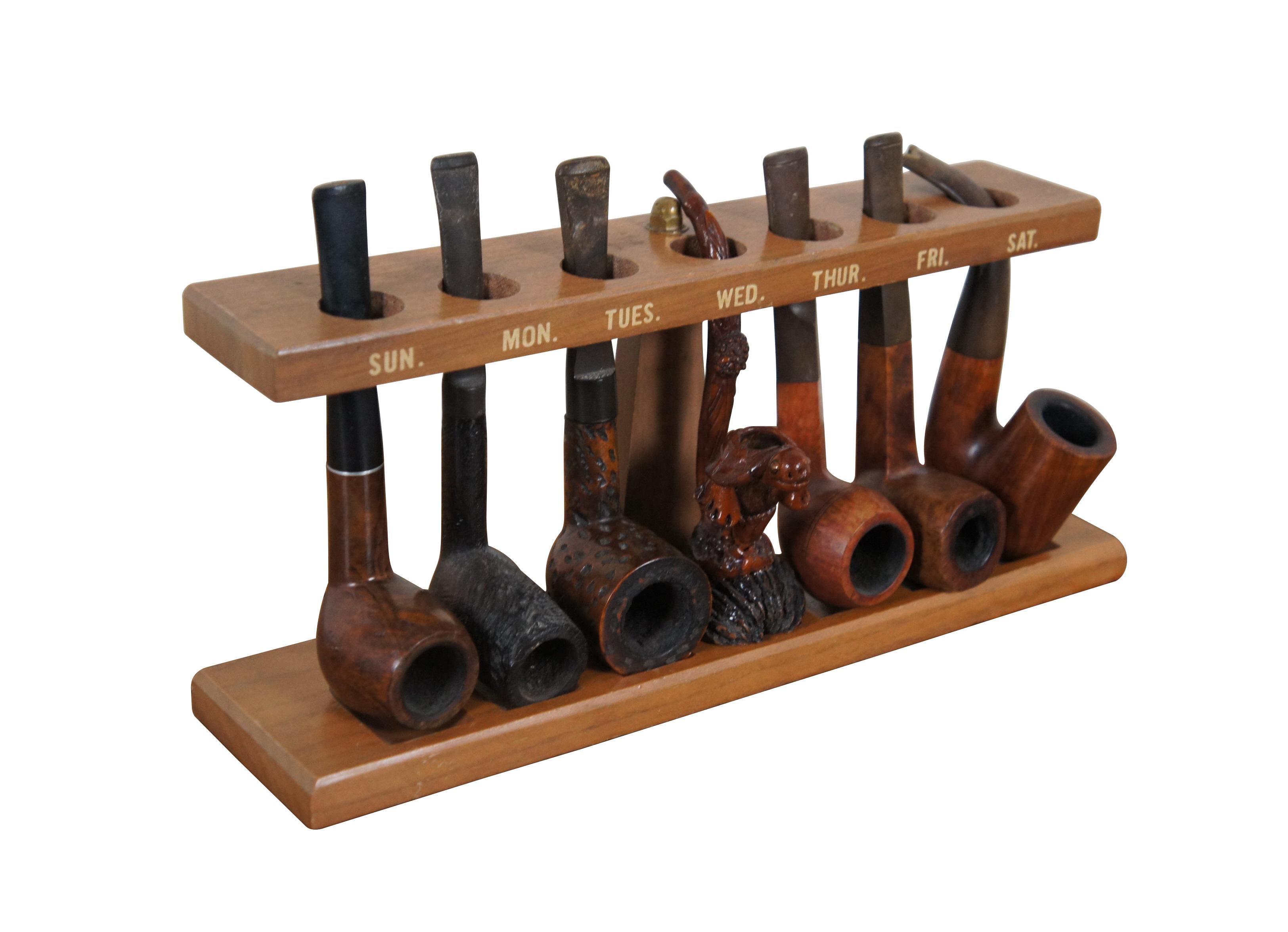 Juego de siete pipas de brezo vintage variadas. Cuatro llevan la marca: 7 Lindbergh Chorro de arena (pila / chimenea en forma de billar, vástago de sillín doblado) / Sasieni Royal Stuart Made in England  (billar doblado, tallo cónico) / Roget de
