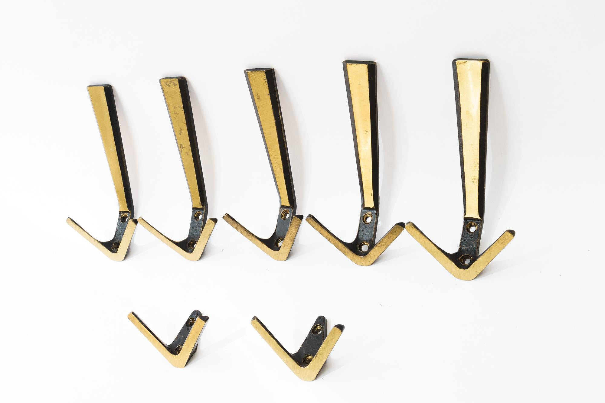 7 Wall Hooks by Herta Baller, around 1950s
Original condition
Size hooks bigger one: 
H: 15.5cm
W: 7.5cm
D: 7.5cm

Size smaller one:
H: 5cm
W: 7.5cm
D: 4cm