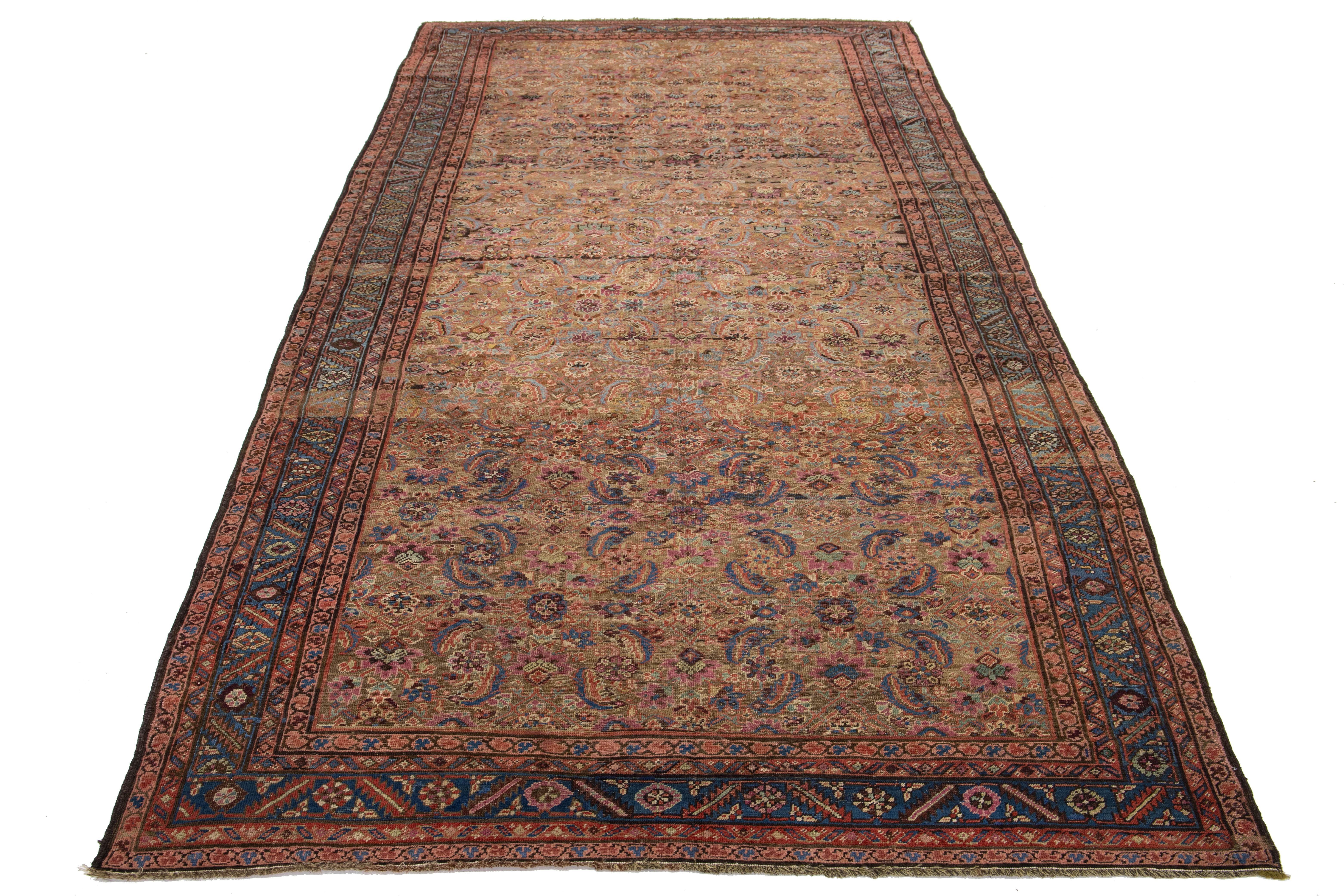 This Bakshaeish Persian hand-knotted rug showcases a striking brown field enhanced by multicolored accents, intricately woven into a captivating all-over floral design. It is perfect for adding a touch of sophisticated charm to any space.

This rug