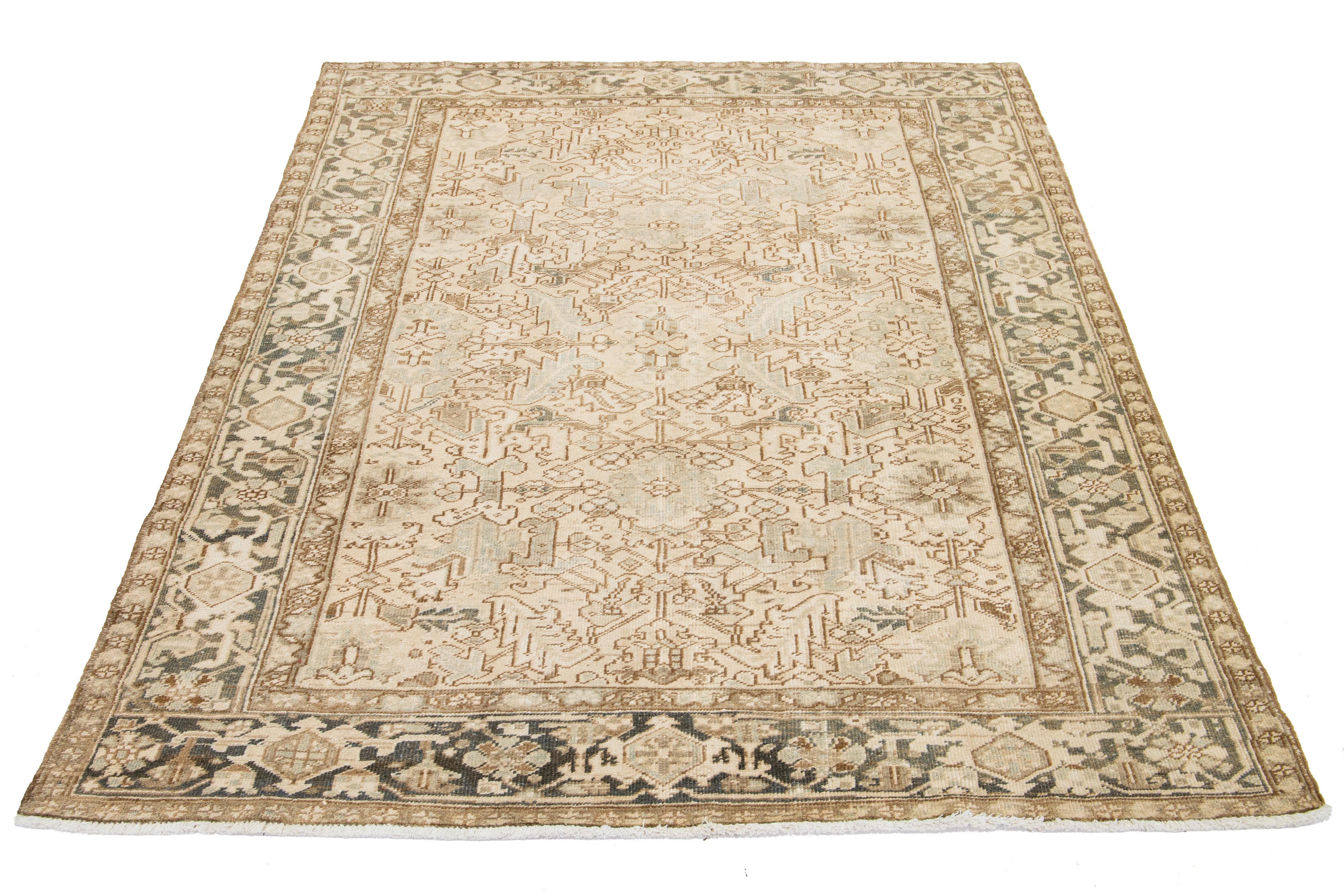An antique rug from Persia is hand-knotted using wool. It has a beige field with a blue and brown all-over pattern.

This rug measures 6'8' x 8'10