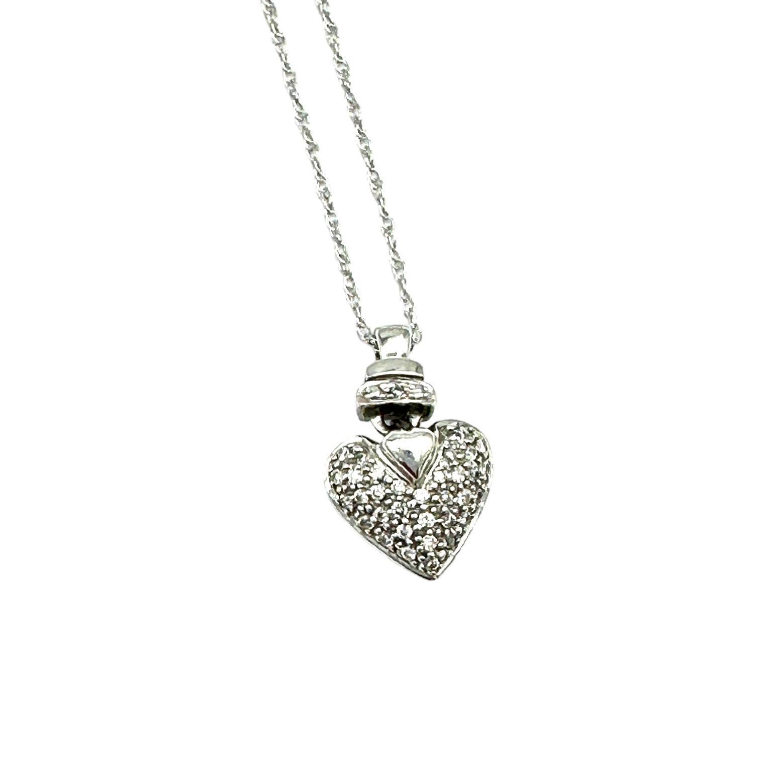 Ciondolo da 0,70 carati in oro bianco 14Kt con cuore a soffietto e diamanti da 1/2
