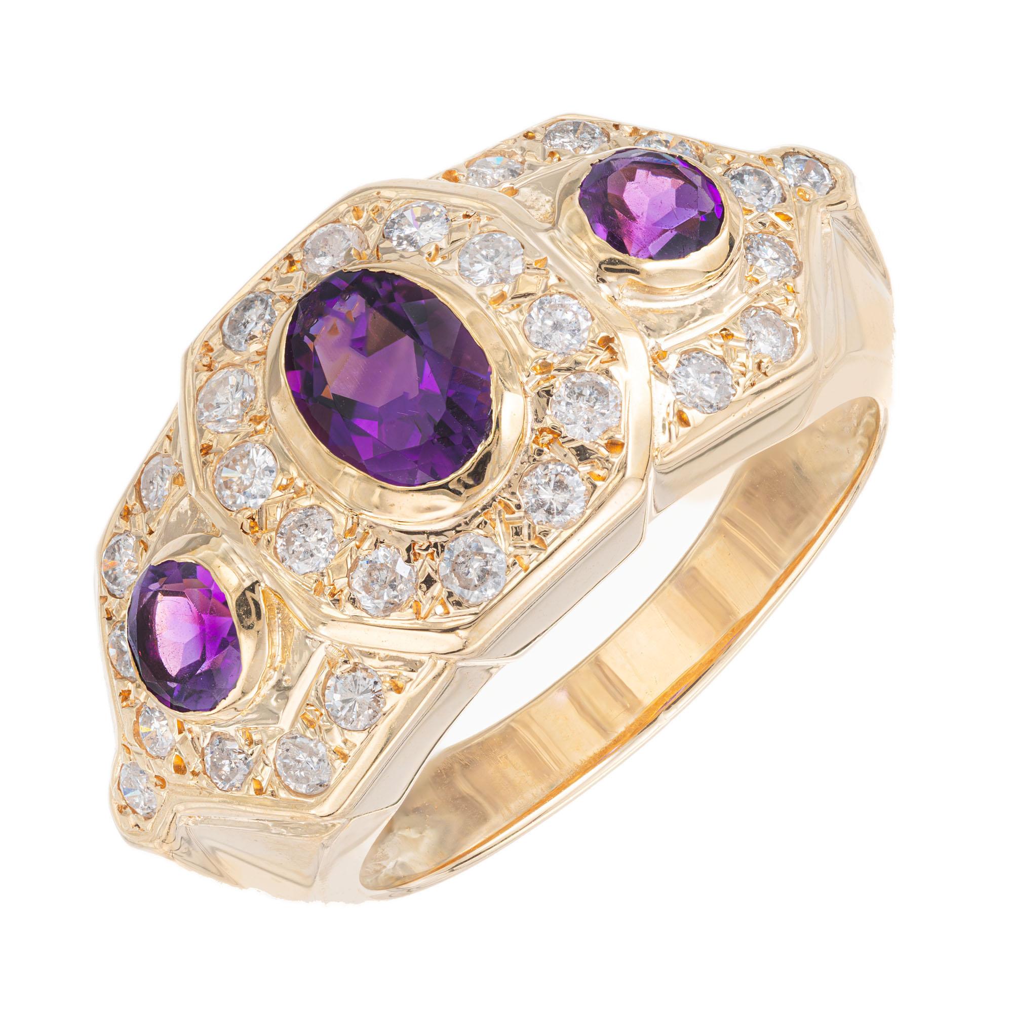 Oval and round amethyst 1980’s cocktail ring with brilliant cut accent diamonds in a 14k yellow gold setting. 

1 oval purple amethyst, approx. .40cts
2 round purple amethyst, approx. .30cts
28 round brilliant cut diamonds, G-H SI approx.