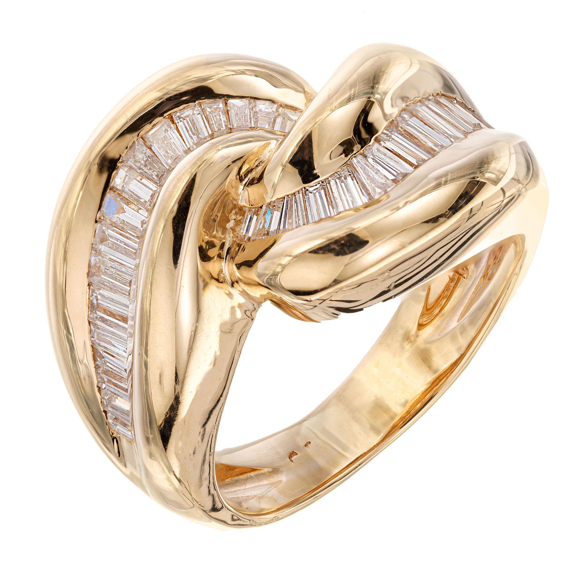 Diamond Swirl design 1960's cocktail ring. 36 Baguette diamonds in a 14k yellow gold setting. Signed KA, number 4761.

36 baguette diamonds, approx. total weight .70cts, F, VS – SI
Size 5.5 and sizable
14k yellow gold
Tested and stamped: