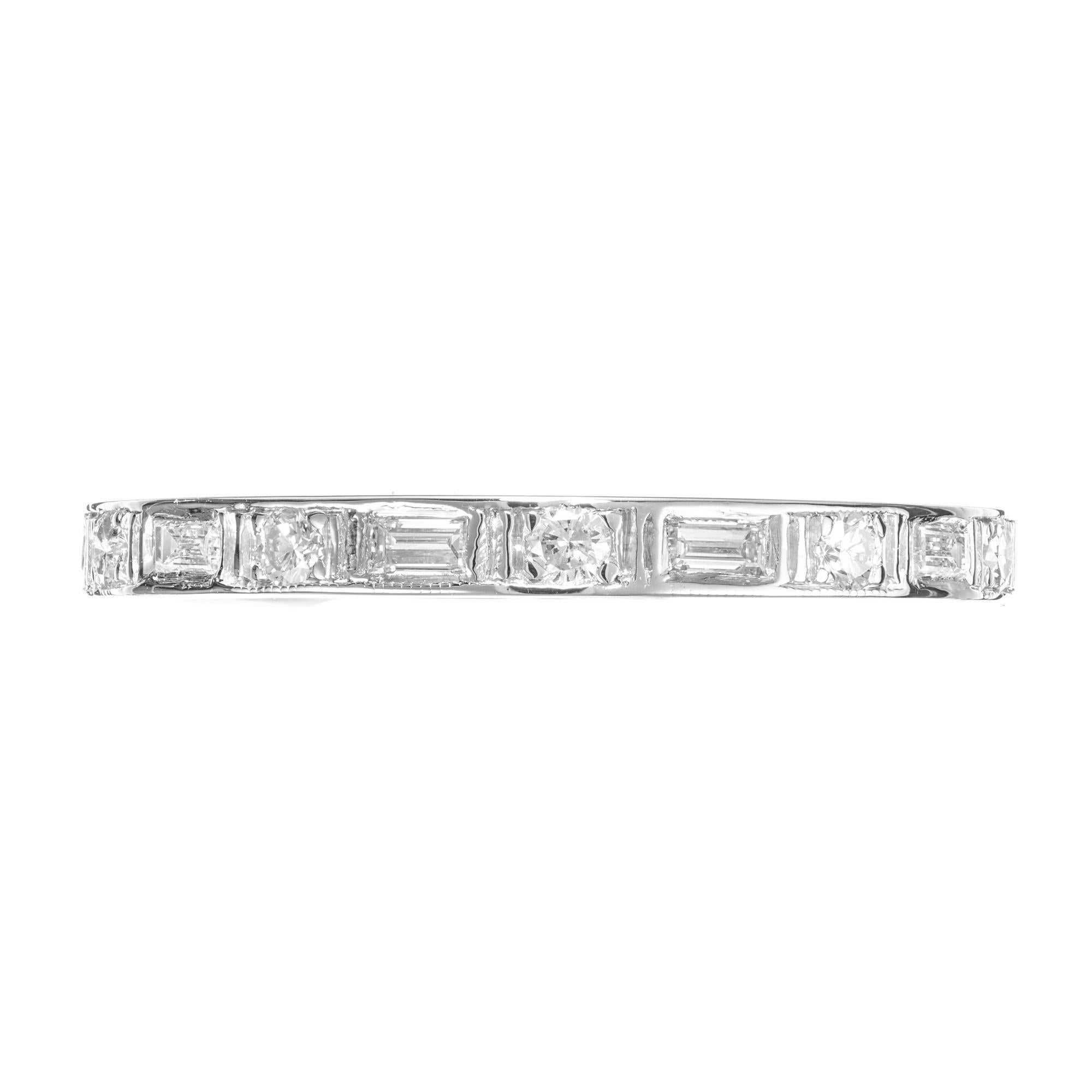 1950's Diamond eternity wedding band ring. 10 round diamonds with 10 straight cut baguette diamonds, set in a platinum eternity setting.  

10 round diamonds, H-I SI approx. .20cts
10 straight cut baguettes, H-I VSI approx. .50cts
Size 8.5 and not