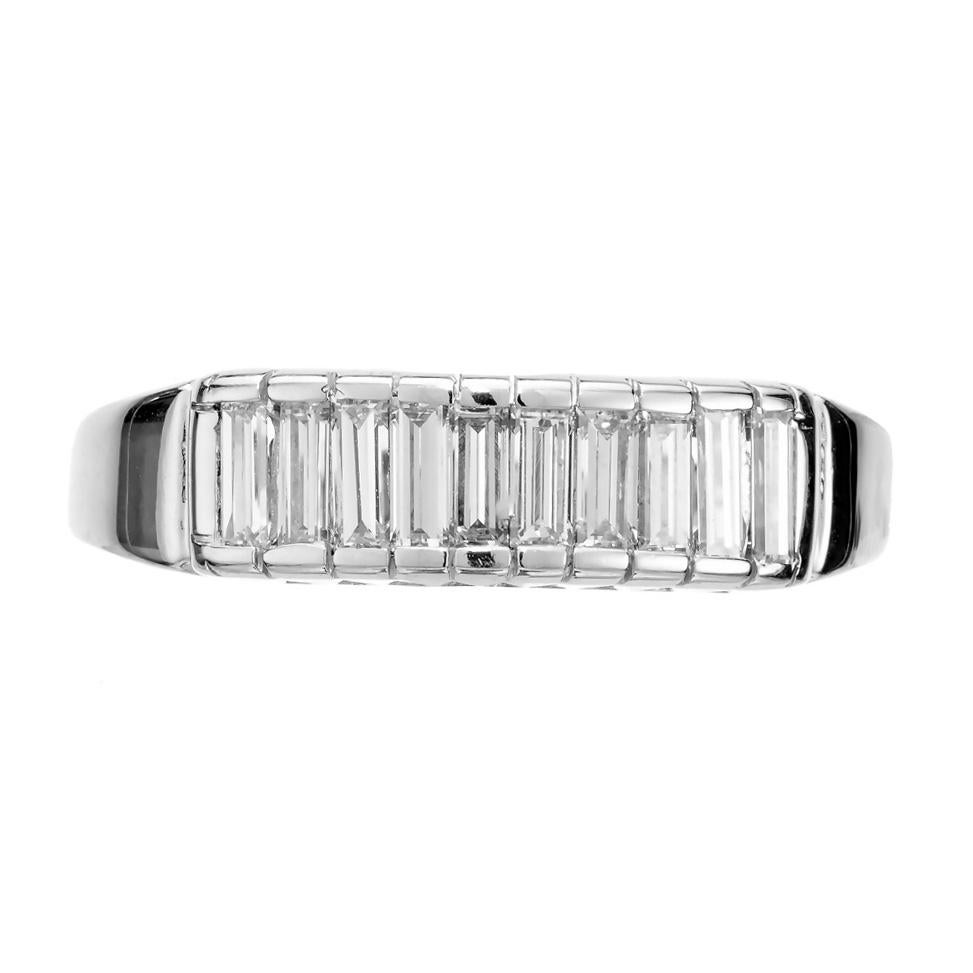 1950's Diamond baguette wedding band ring. 10 baguette diamonds set in 14k white gold bar style setting. 

10 baguette diamonds, I VS2 approx. .70cts
Size 7.75 and sizable
14k white gold
Stamped: 14k
3.7 grams
Width at top: 5.4mm
Height at top: