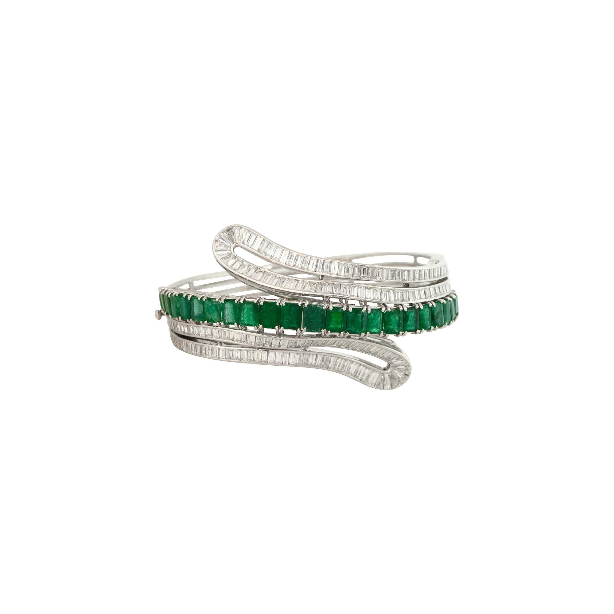 18k White Gold 7.0ctw Emerald and Diamond Bangle Bracelet

Material: 18k White Gold
Gemstone Details: Approximately 7.0ctw of Emerald Cut Emeralds
Diamond Details: Approximately 3.8ctw of Emerald Cut Diamonds
Total Weight: 64.9g (41.9dwts)
Size: