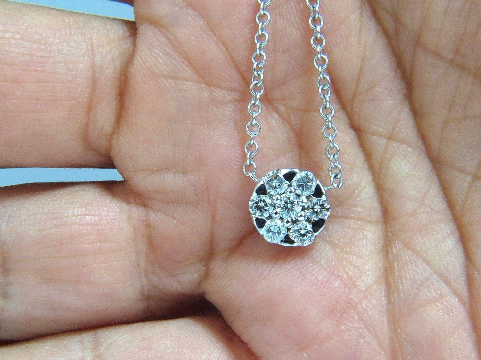 Aside from standard

 .70ct. Diamonds cluster necklace:

7 diamonds in cluster

All diamonds: full cut & rounds

H color,  Si-2 clarity.

14kt. white gold. 

4.6 grams

Diameter: .37 inch

16 inches long.

please see all photos 

$3500 Appraisal