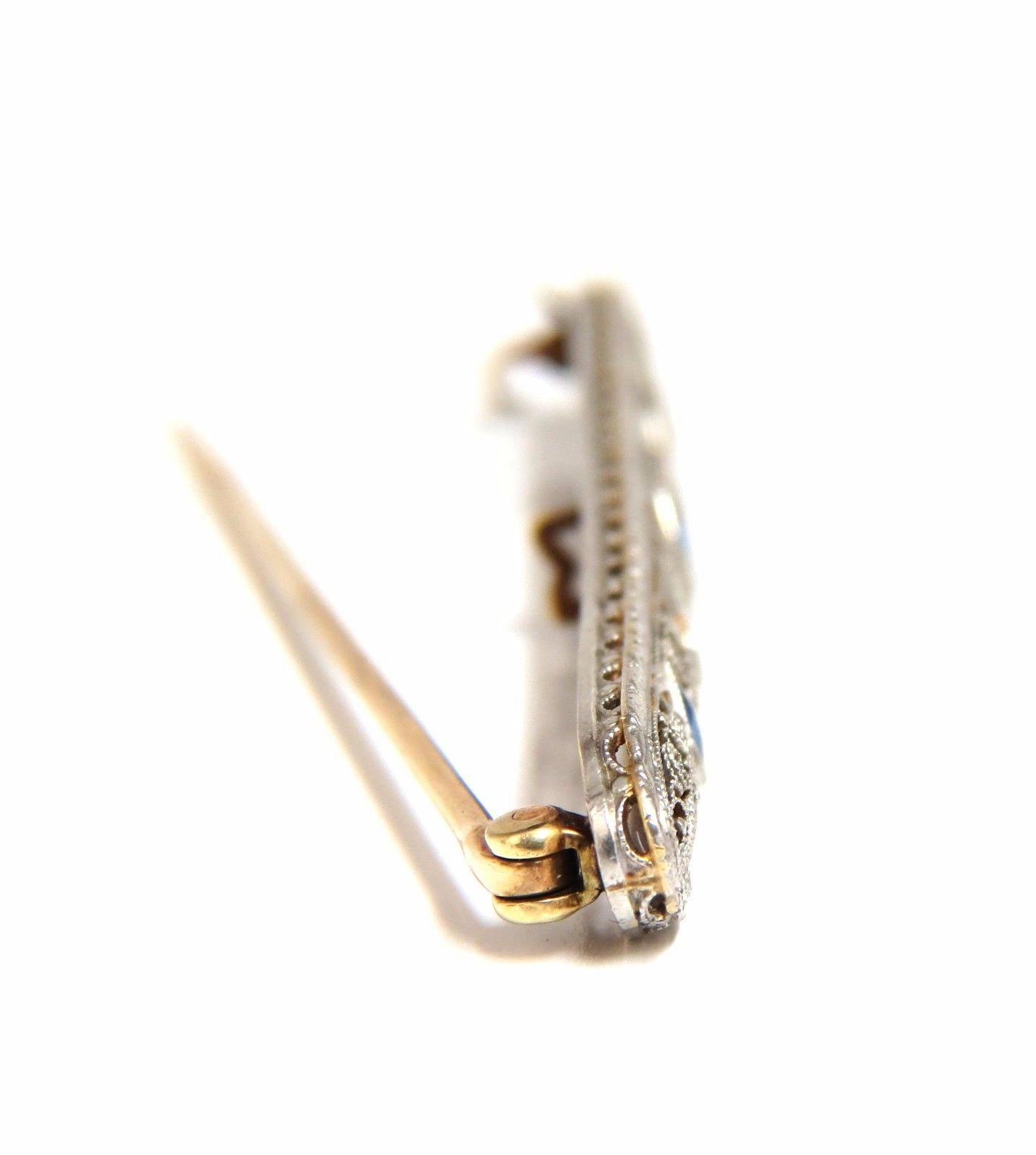 Edwardian Class.

.60ct. natural sapphires long brooch pin.

Rounds, Full cut Brilliant.

.10ct diamonds:

G-color Vs-2 Si-1 clarity.

14kt gold 

5.5 grams.

Overall: 2.7 X .28 inch

Excellent made 