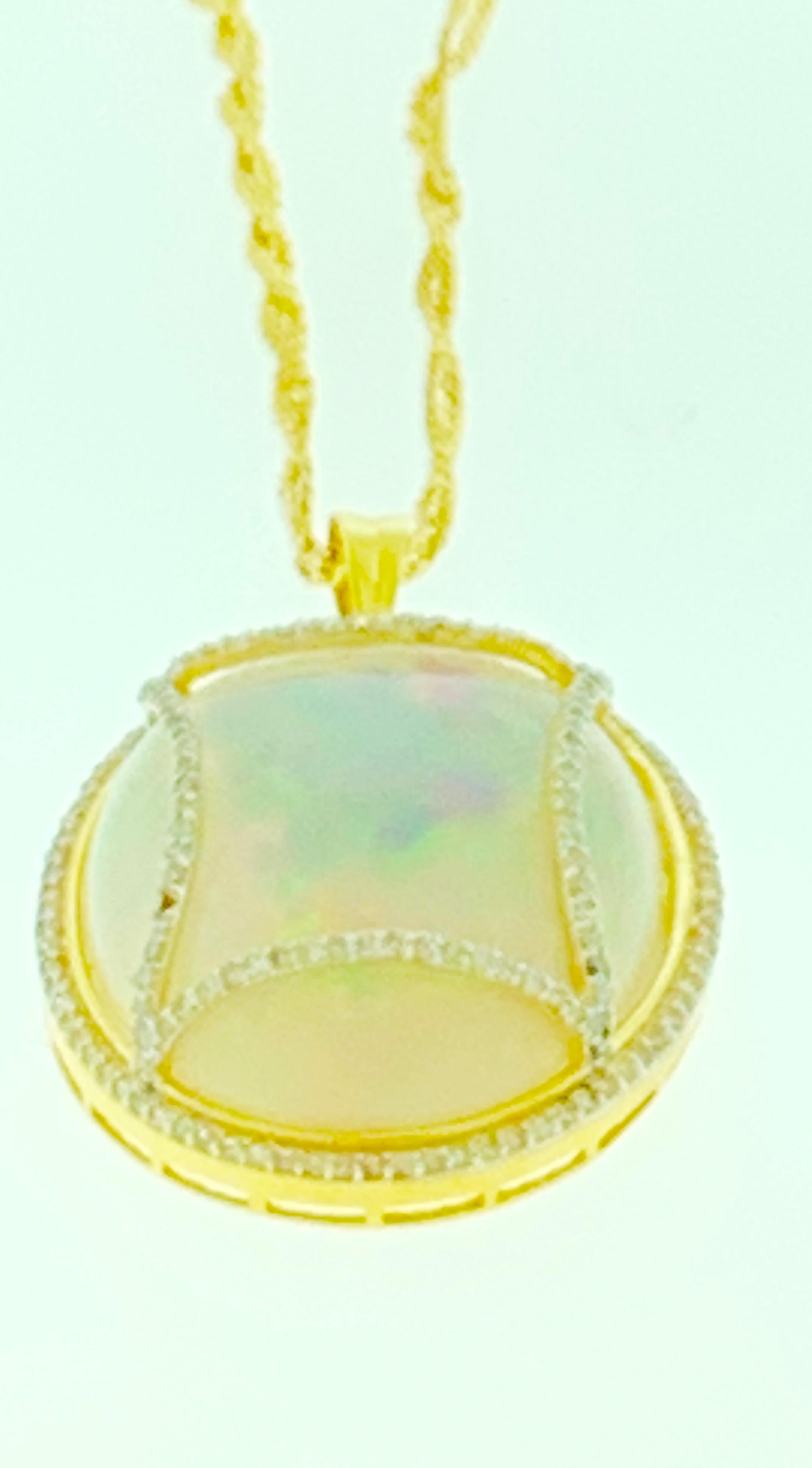 70 Carat Oval Ethiopian Opal and Diamond Pendant or Necklace 14 Karat Gold In Excellent Condition For Sale In New York, NY
