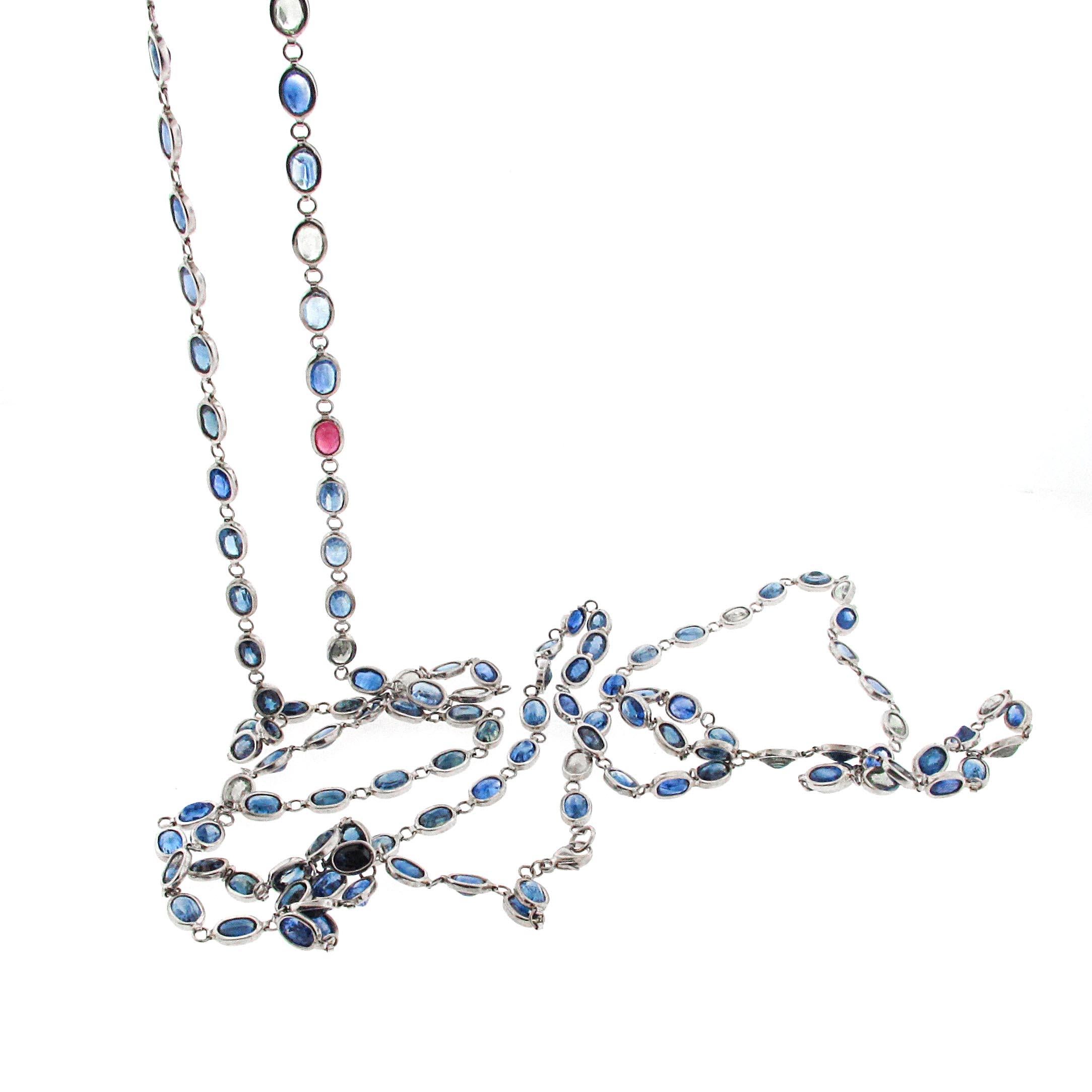 This is a long chain, with gorgeous blue sapphires. There are 132 sapphires hand set in 14kt white gold along with 1 ruby. This ruby creates a great change in the chain and makes for a spectacular piece. The chain is 55 inches long which means you