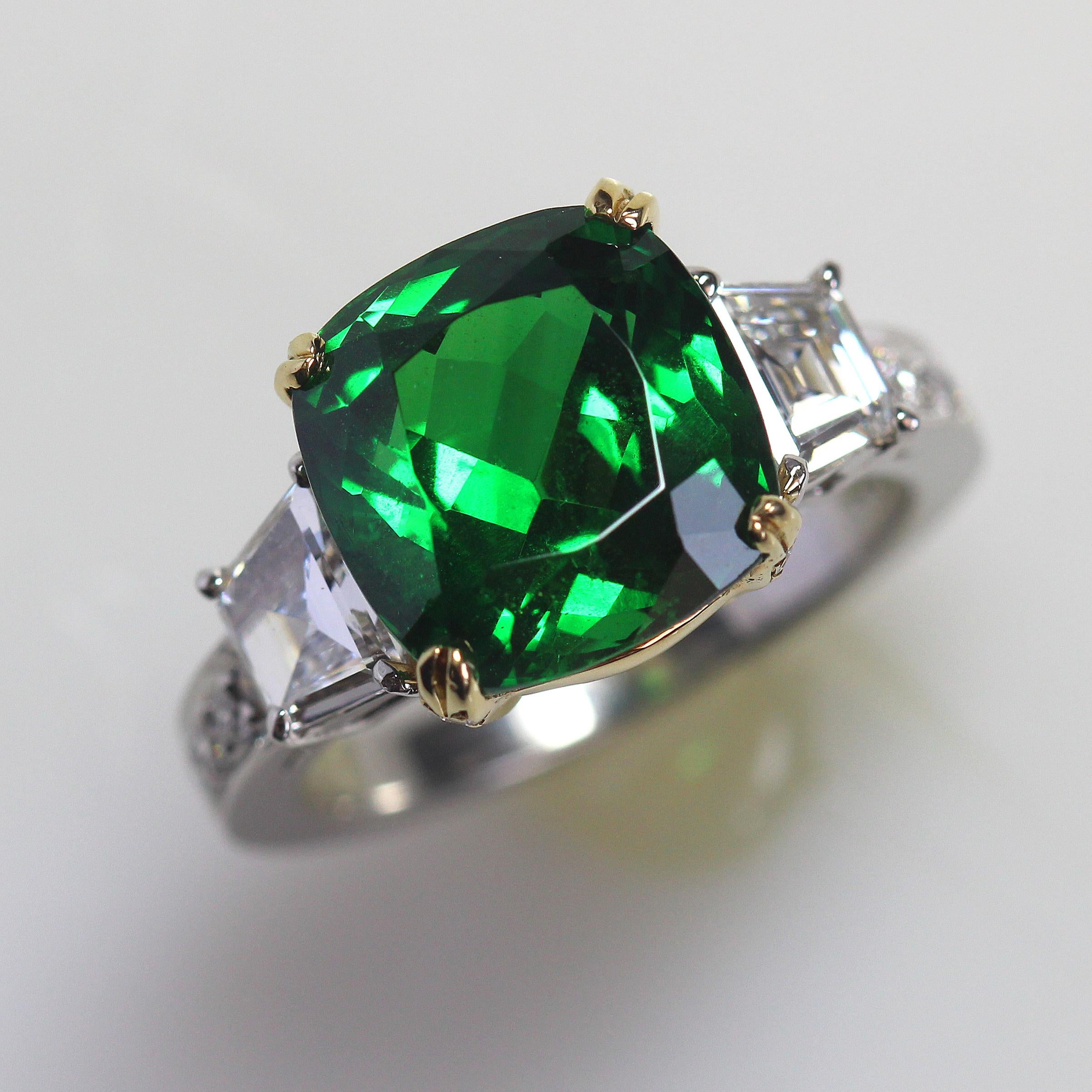 B8085001

Center Details:
1. Carat Weight: 6.92 ( A Tsavorite This Size and Intensity of Color is Incredibly Rare)
2. Color: Green
3. Tone:  Medium - Nice, 7.0 Out of 10
4. Hue: Intense Green.
5. Clarity:  Excellent clarity
6. Cut: This stone has a
