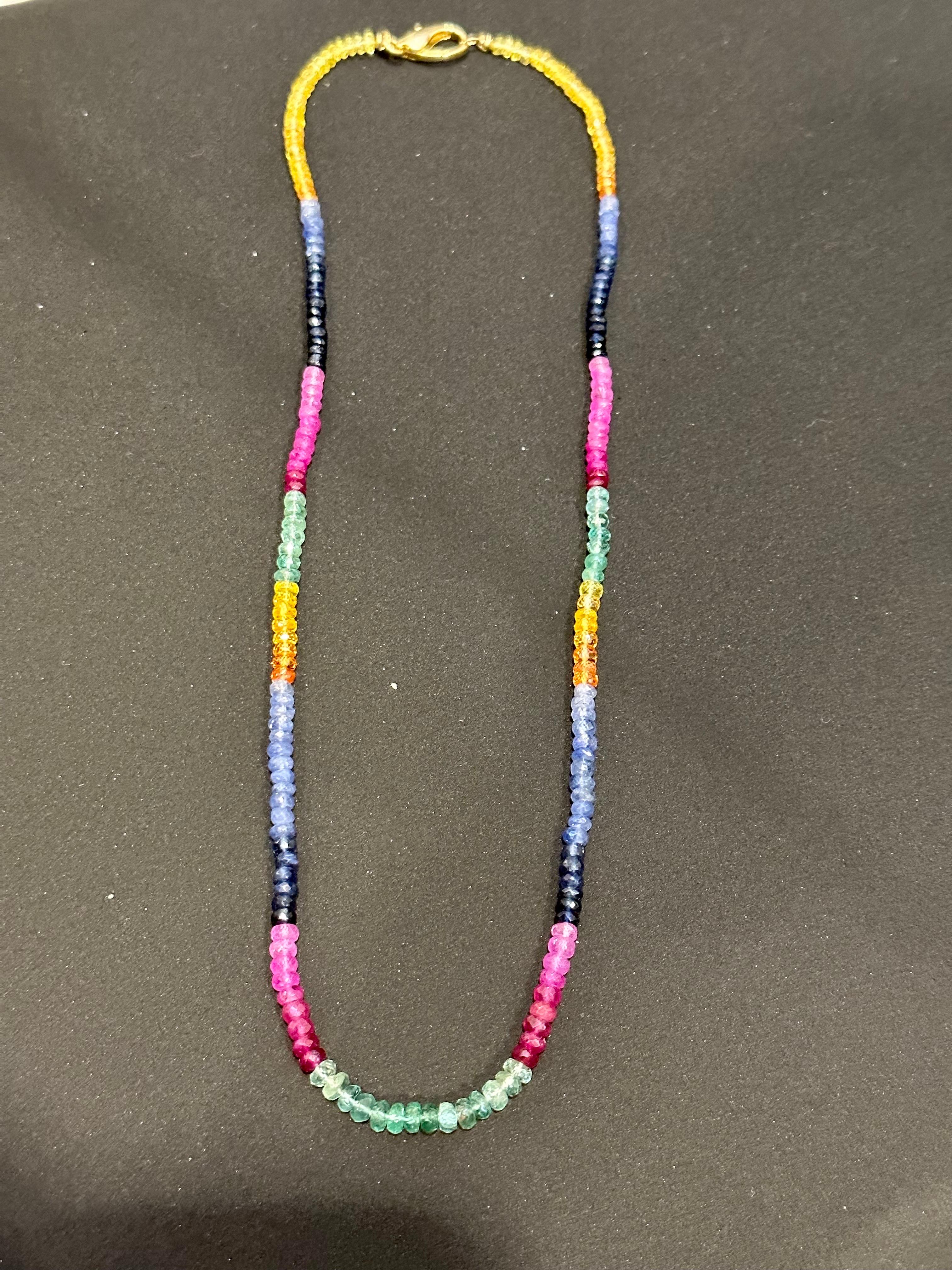 Approximately 70 Ct Single  Layer Faceted  Natural Emerald Ruby & Sapphire Bead Necklace  14 Karat  yellow Gold  Clasp
This spectacular Necklace   consisting of approximately 70 Ct   of  Fine and natural beads of all precious stones ,,, Emerald ,