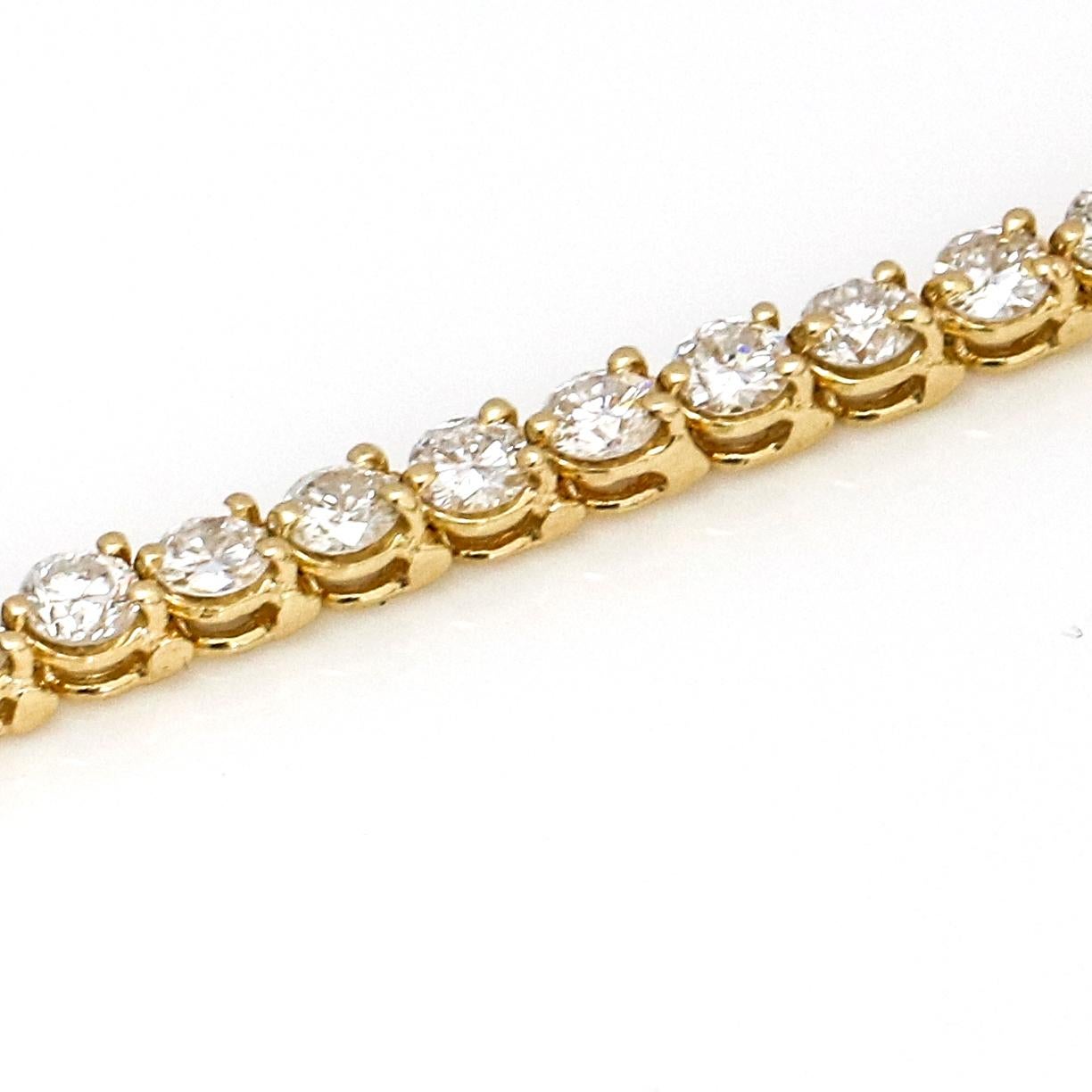 7.00 Carat 14 Karat Yellow Gold Diamond Tennis Bracelet In Good Condition For Sale In Fort Lauderdale, FL