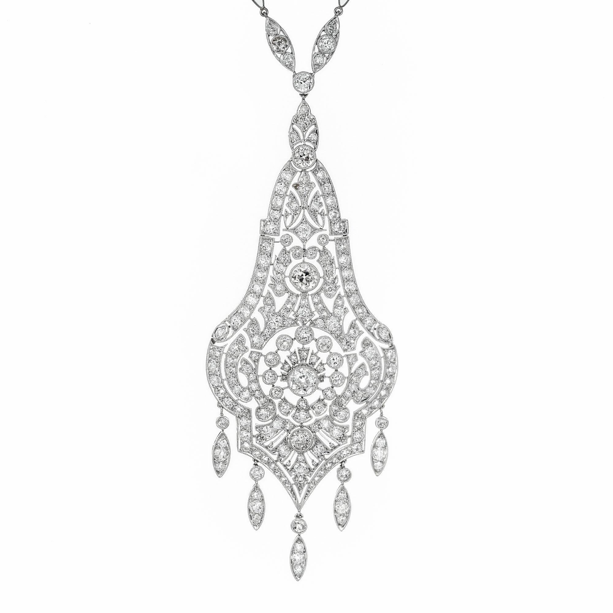 Edwardian Belle Époque diamond pendant necklace. Circa 1910. Three section diamond filled hinged pendant with 5 dangles at the bottom set in platinum. Pendant is Handmade with a diamond and swirl link chain.  Old European cut diamonds approximately