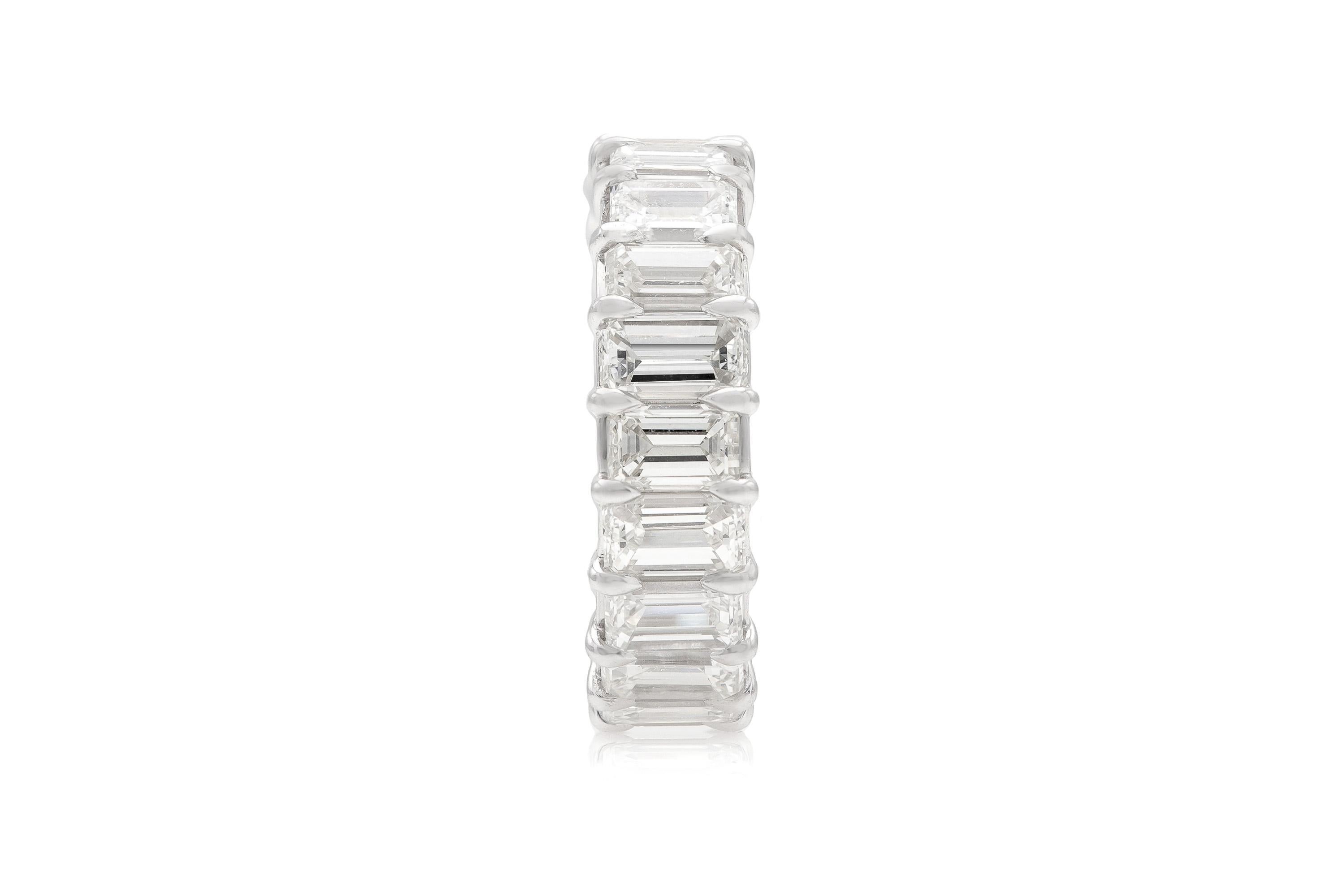 Finely crafted in platinum with 20 Emerald cut Diamonds weighing a total of approximately 7.00 carats, H-I color, VS1-VS2 clarity.
6mm wide
Size 6