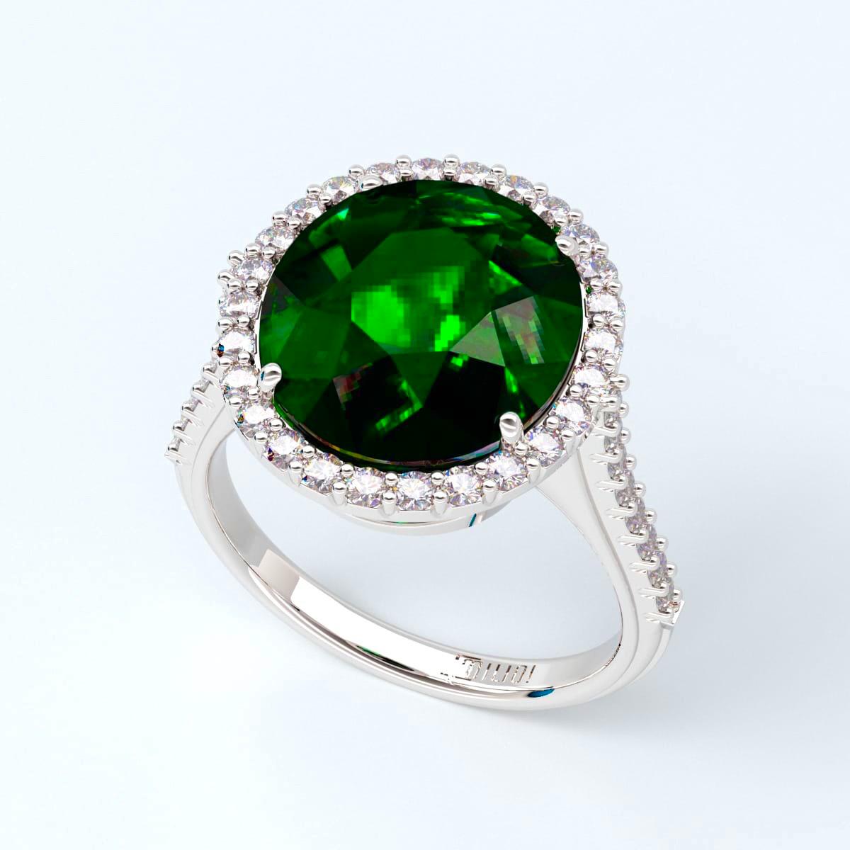 Gorgeous center emerald full of life and color set in this gorgeous hand made halo diamond mounting made of Platinum. 
We will alter the ring size to your exact finger size. 
The diamond quality is E color vs1 clarity. 
The center emerald has an