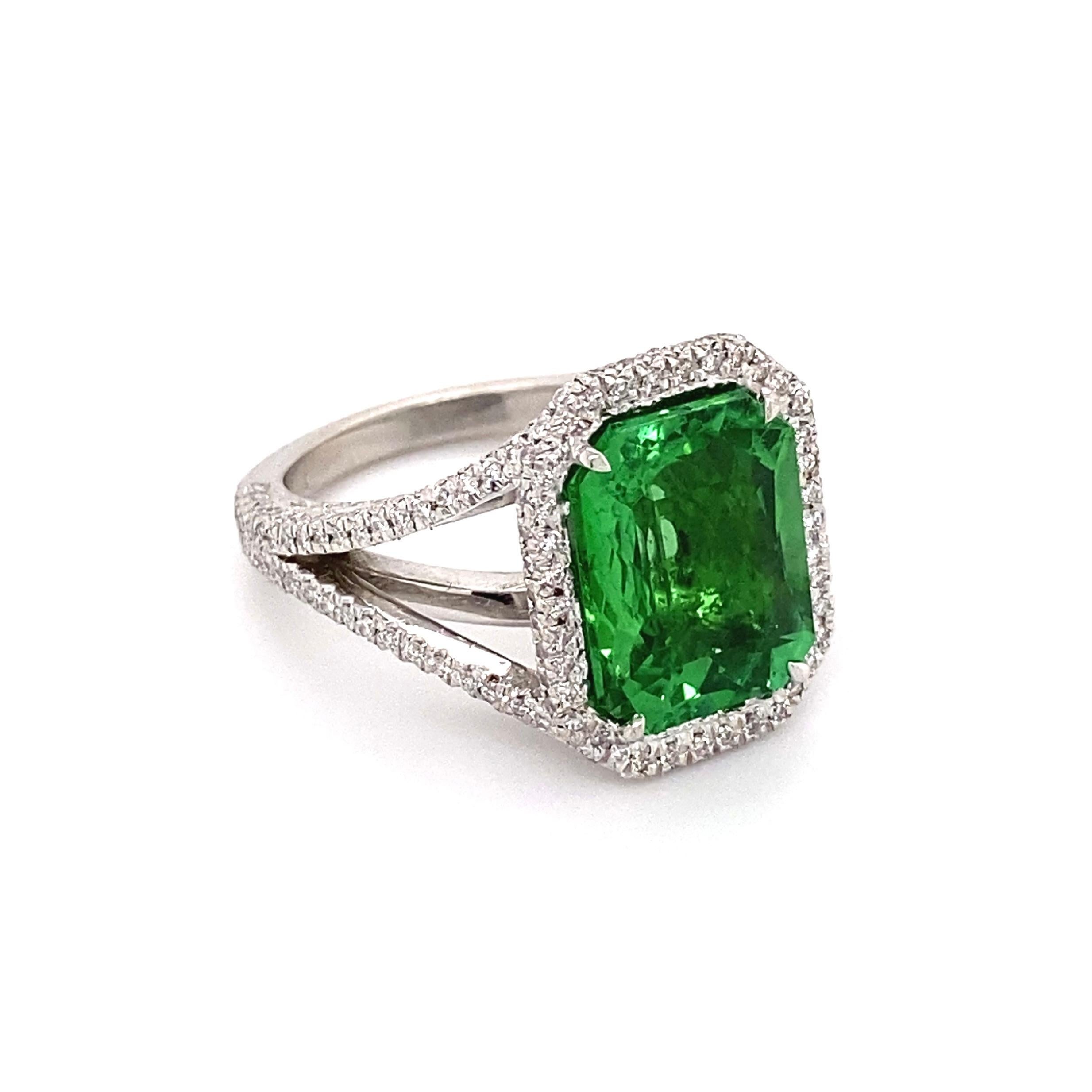 Beautiful Green Paraiba Tourmaline and Diamond Platinum Cocktail Ring, center securely hand set with an Octagonal Paraiba, weighing approx. 6.00 Carat; surrounded by prong set Diamonds approx. 2.27tcw. Hand crafted centerpiece of an amazing Platinum