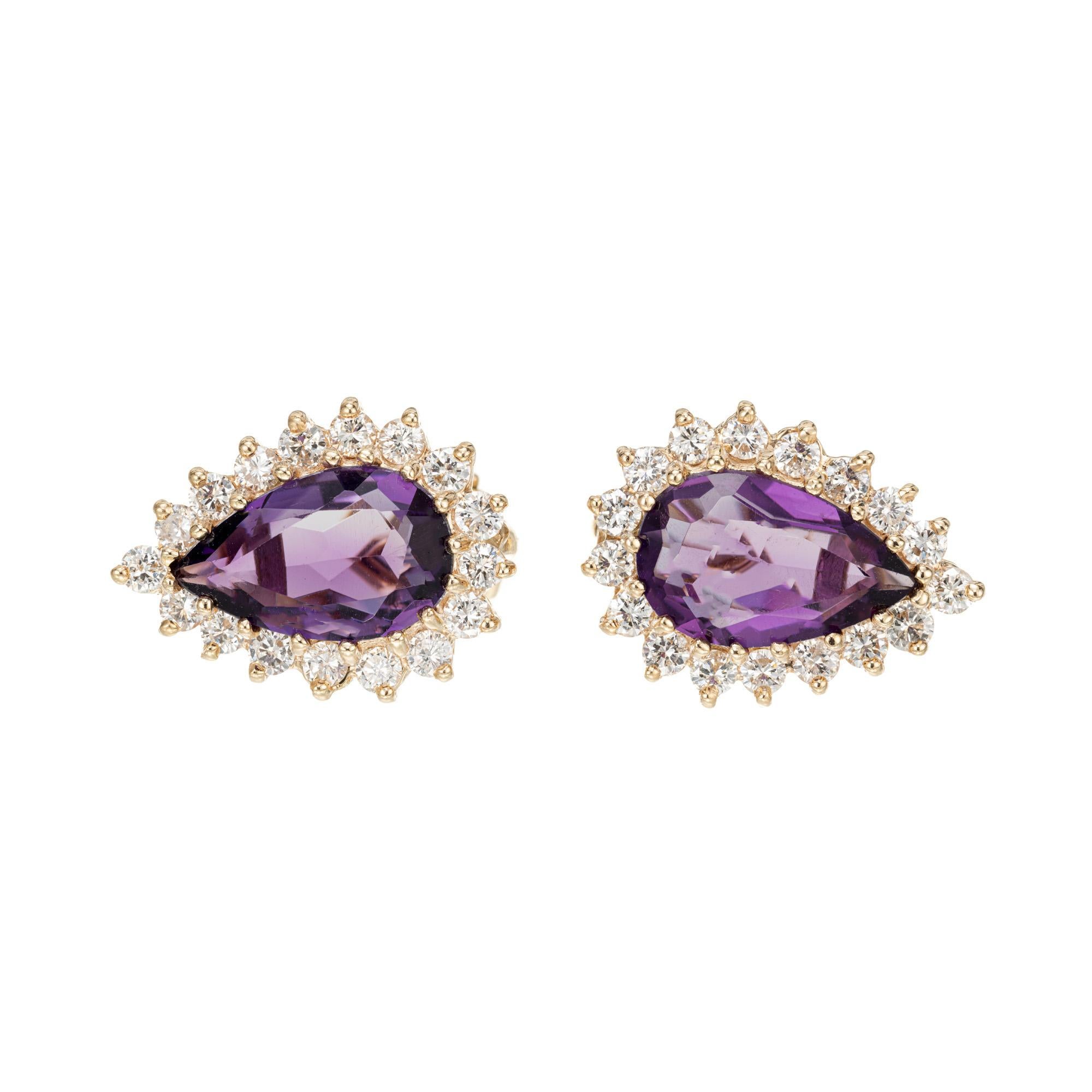 1960's Amethyst and diamond halo earrings. 2 pear shaped amethyst each with a halo of round full cut diamonds in 14 yellow gold clip post style settings.

2, 13 x 8.5mm fine pear bright purple Amethyst, approx. total weight 7.00cts, VS
34 round full
