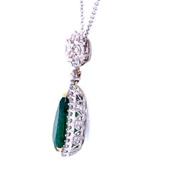 7.00 Carat Pear Shape Emerald Pendant in 18K Gold with 1.85 Carat Diamonds Halo
