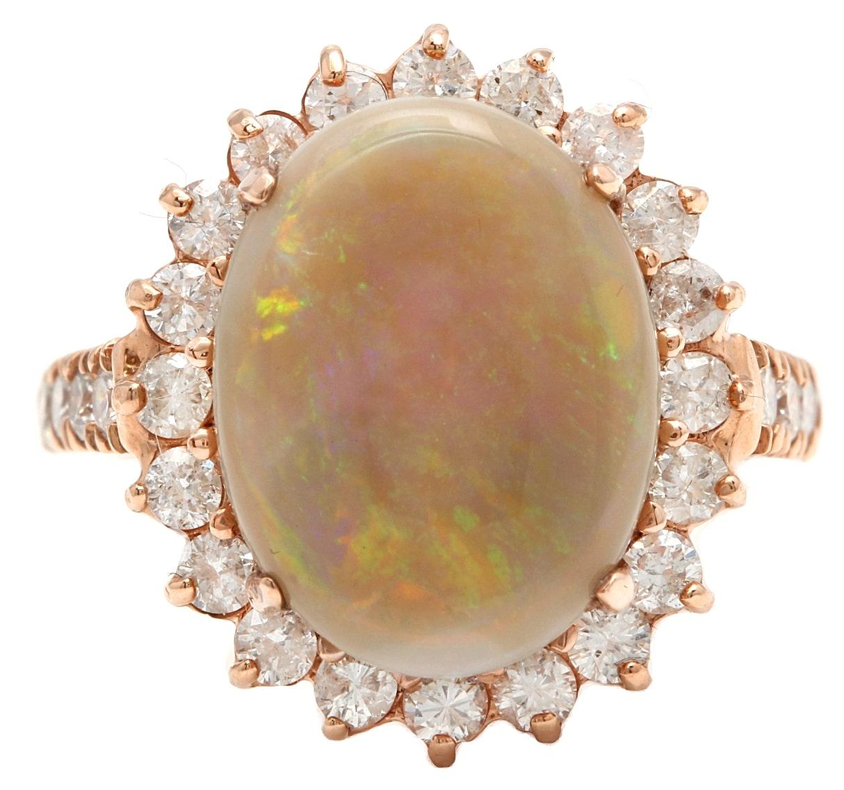 7.00 Carats Natural Impressive Australian Opal and Diamond 14K Solid Rose Gold Ring

Amazing play of colors opal. Pictures don't show the beauty of the opal.

Suggested Replacement Value: 6,800.00

Total Natural Opal Weight is: Approx. 6.00 Carats