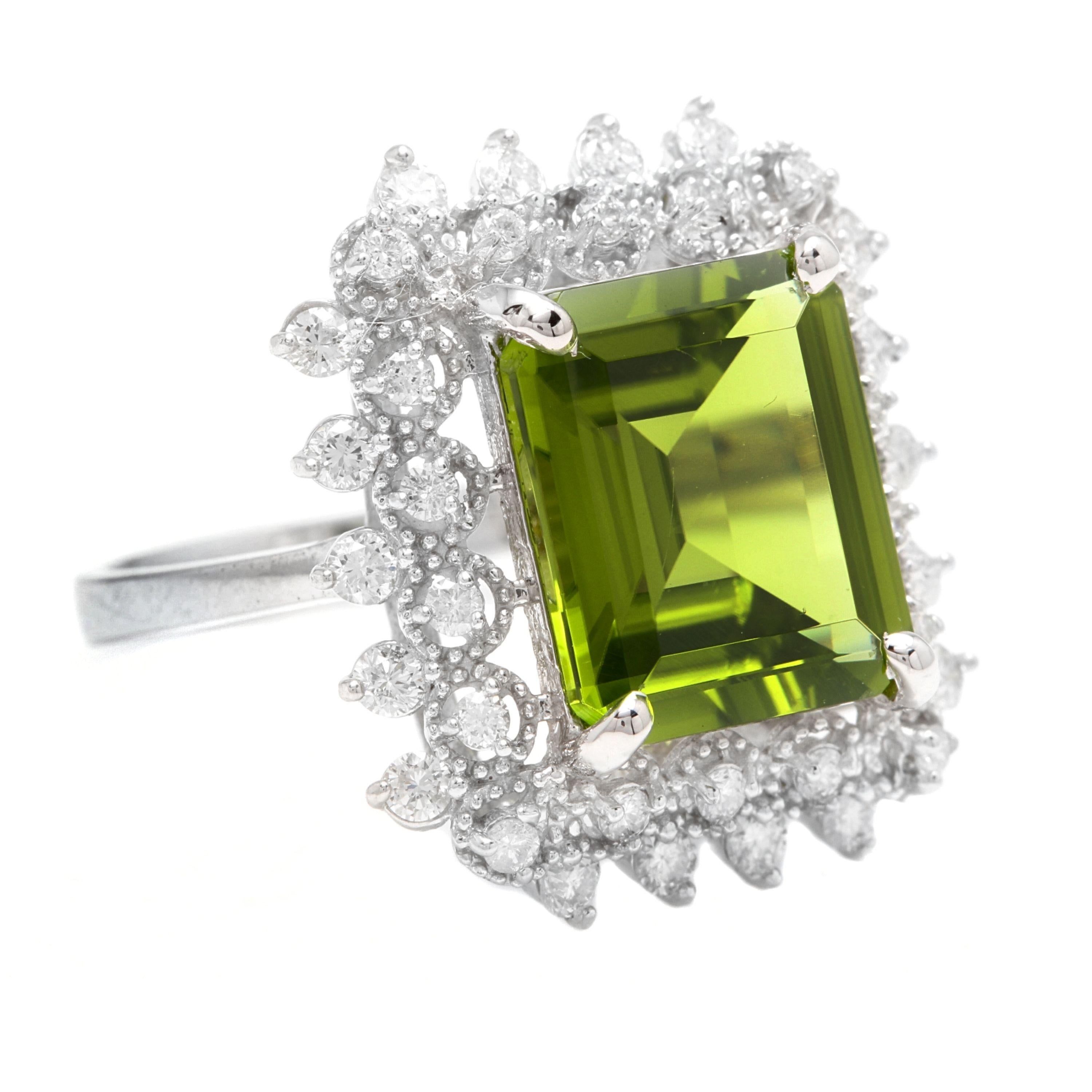 7.00 Carats Natural Very Nice Looking Peridot and Diamond 14K Solid White Gold Ring

Stamped: 14K

Total Natural Emerald Cut Peridot Weight is: Approx. 6.20 Carats

Peridot Measures: Approx. 12 x 10mm

Natural Round Diamonds Weight: Approx. 0.80