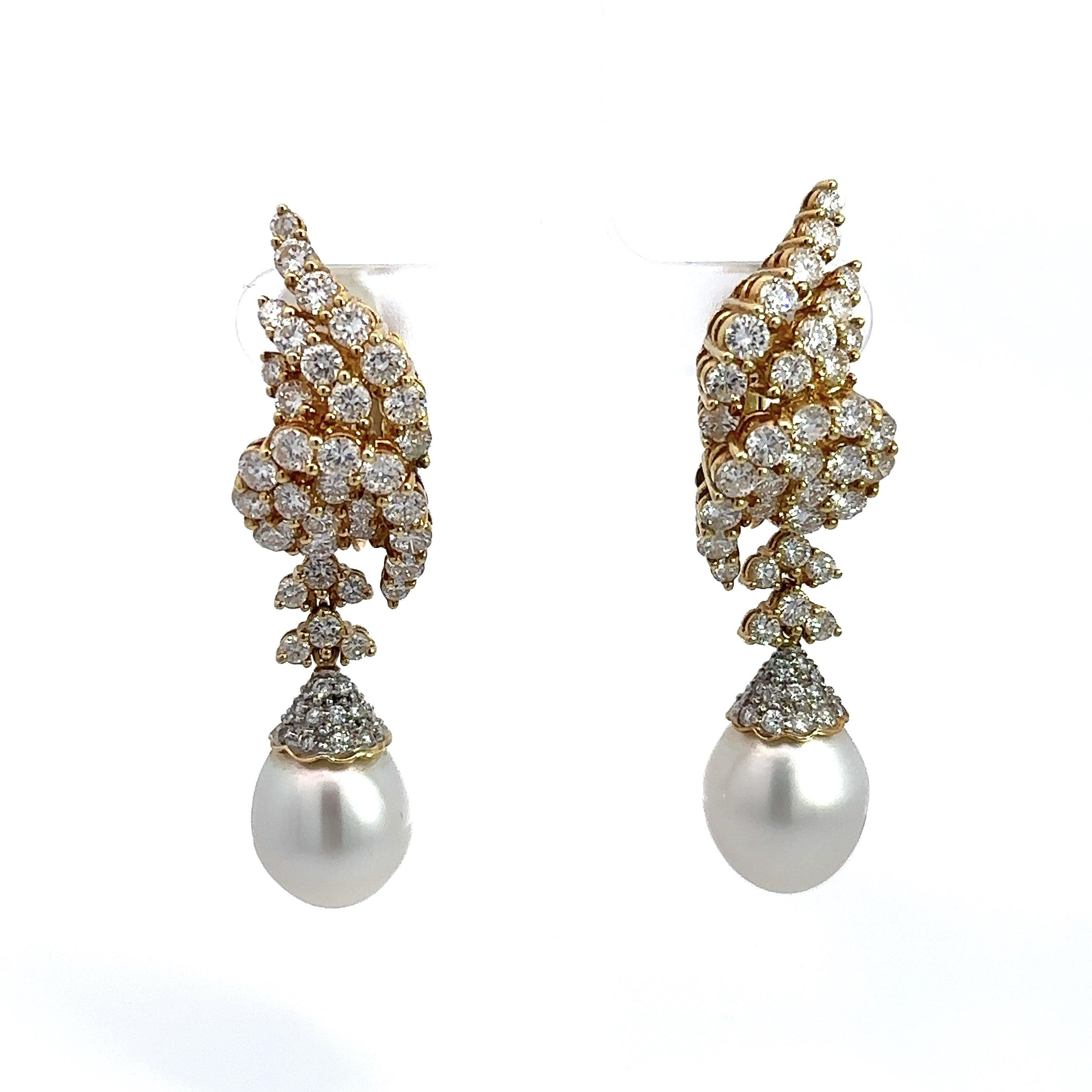 Stunning South Sea Pearl and Diamond Dangle Earrings.
7.00cts Brilliant Round Diamonds. 
Diamonds are F-G Color VS-SI Clarity.
12mm South Sea Pearls.
The Pearls are Stunning. 
The total length of the earring is approximately 2