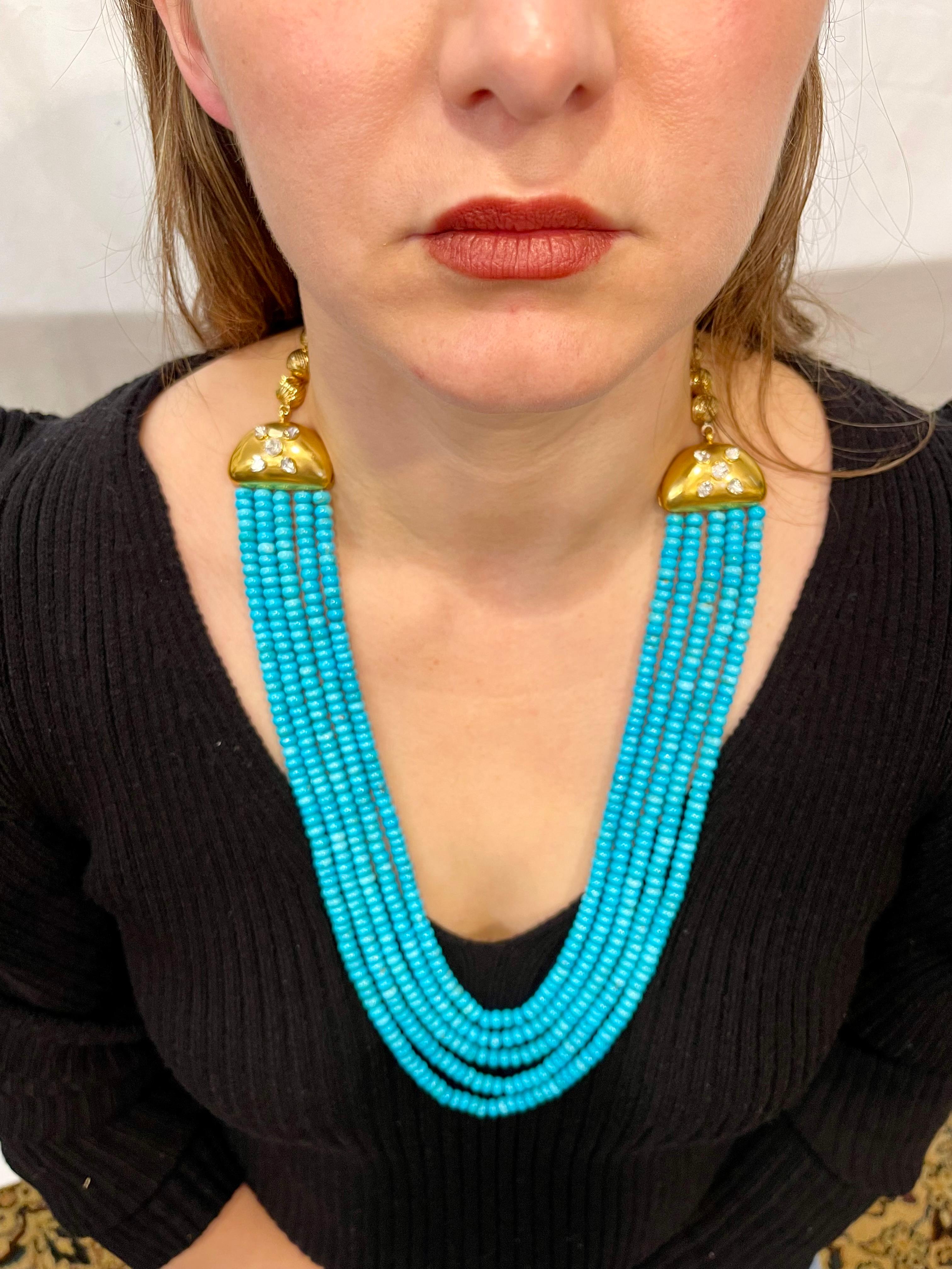 Approximately 700 Carat Natural Sleeping Beauty Turquoise Necklace with  Diamonds on the gold divider and  5 Strand 14 Karat Gold
Natural Sleeping Beauty Turquoise which is very hard to find now.
Necklace has 5 strand
Approximately 5. 5 to 6.5 mm
