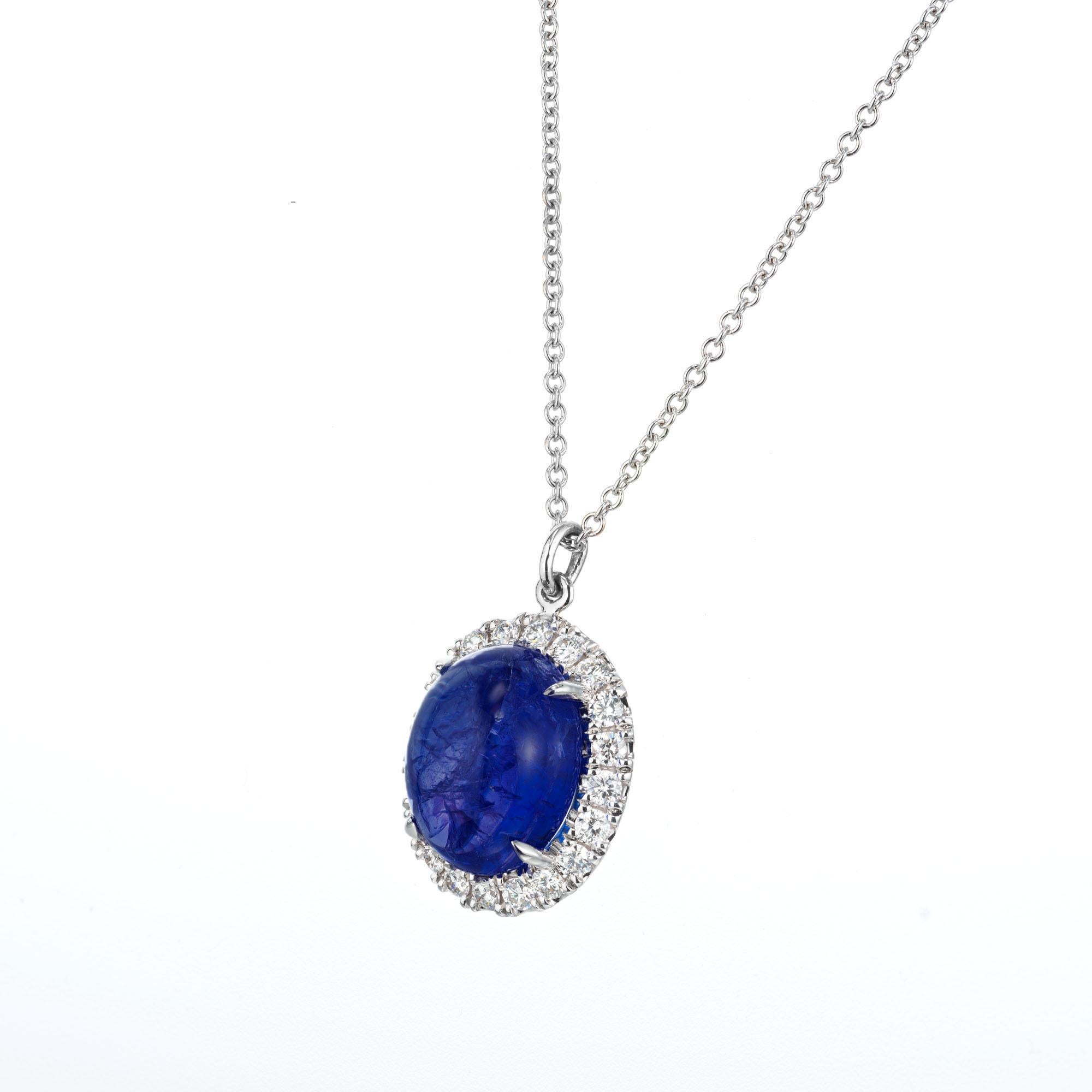 Oval Blue 7.00 carat tanzanite with a halo of round brilliant cut diamonds set in 18k white gold on a 18 inch long chain. Created and crafted in the Peter Suchy Workshop. 

1 oval cabochon blue tanzanite, I approx. 7.00cts
20 round brilliant cut