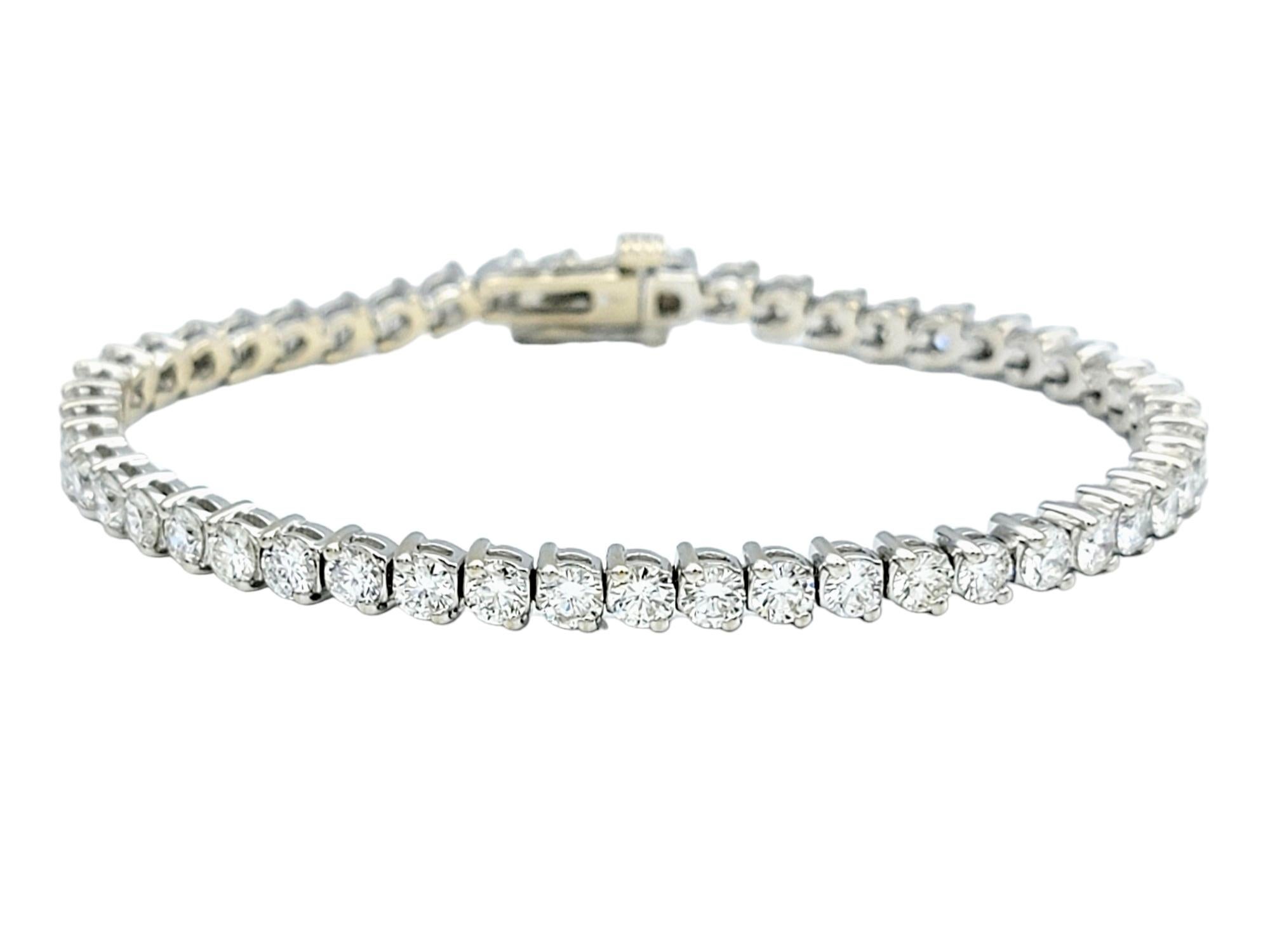 The inner circumference of this bracelet measures 6.5 inches and will comfortably fit up to a 6.25 inch wrist. 

This timeless diamond tennis bracelet is a radiant display of elegance and refinement. Set in lustrous 18 karat white gold, the bracelet