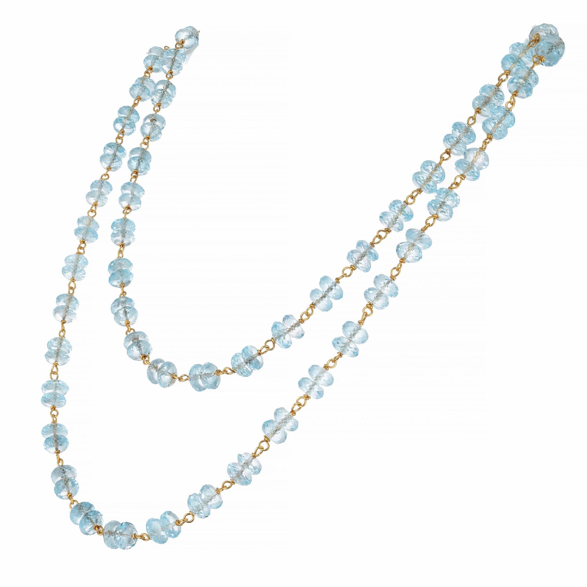 Faceted blue topaz rondelle briolette beaded necklace with hand twisted 14k wire connectors. 32 in length can be worn double.  The briolettes have great brilliance. 
 
138 blue Topaz 6 x 2.5mm faceted Rondelle Briolettes, approx. total weight