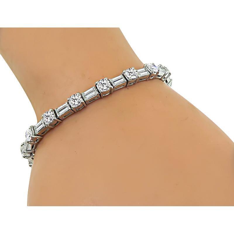 This is a stunning platinum bracelet. The bracelet is set with sparkling round and baguette cut diamonds that weigh approximately 7.00ct. The color of these diamonds is G-I with VS1-VS2 clarity. The bracelet measures 5mm in width and 6 3/4 inches in