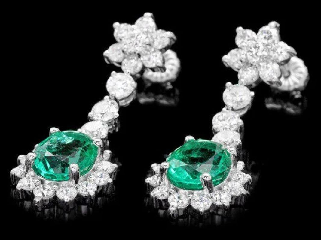 7.00ct Natural Emerald and Diamond 14K Solid White Gold Earrings

Total Natural Oval Emeralds Weight: Approx.  3.90 Carats

Emerald Measures: Approx.  9 x 7 mm

Total Natural Round Cut White Diamonds Weight: Approx.  3.10 Carats (color G-H / Clarity