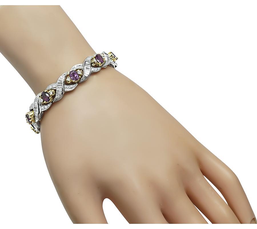 This is a fabulous platinum and gold bracelet. The bracelet is set with lovely oval cut rubies that weigh approximately 7.00ct. The rubies are accentuated by sparkling baguette and round cut diamonds that weigh approximately 3.50ct. The color of