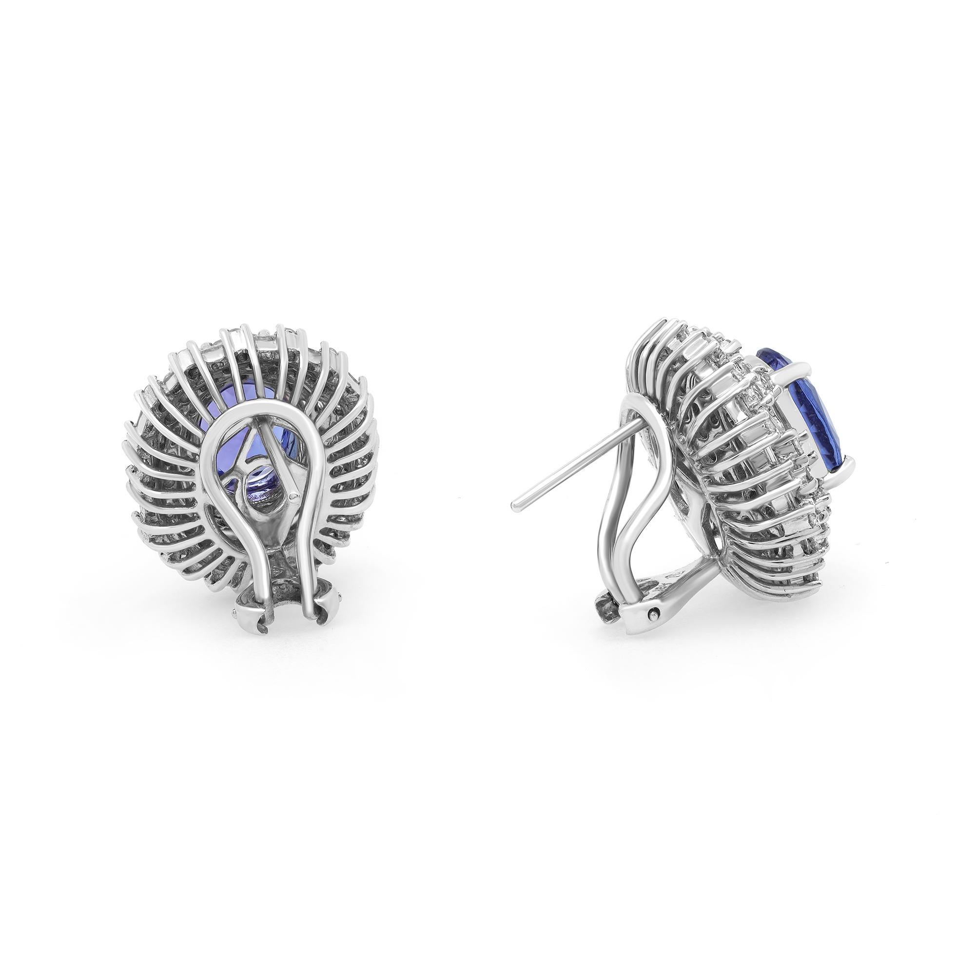 These beautiful earrings feature center oval shaped Tanzanite with baguette and round cut diamonds in prong setting forming a perfect oval. The diamonds are delicately set in fine 18k white gold. A large backing provides extra pledge and comfort by