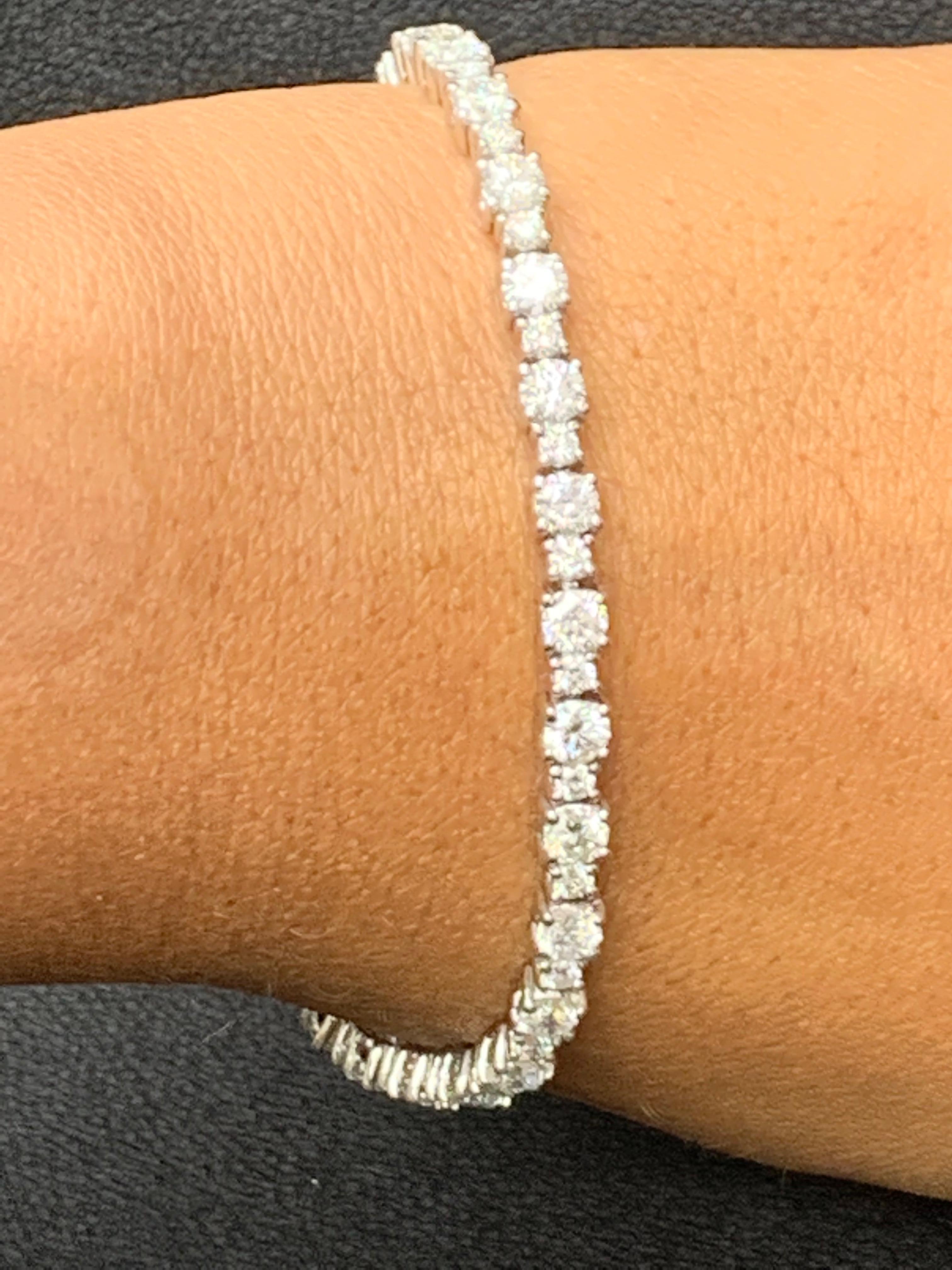 Showcasing 5.78 carats total of 28 brilliant-cut Big diamonds, elegantly alternating with 1.23 carats of 28 round brilliant small diamonds. Made in 14 karats white gold.

Style available in different price ranges. Prices are based on your selection